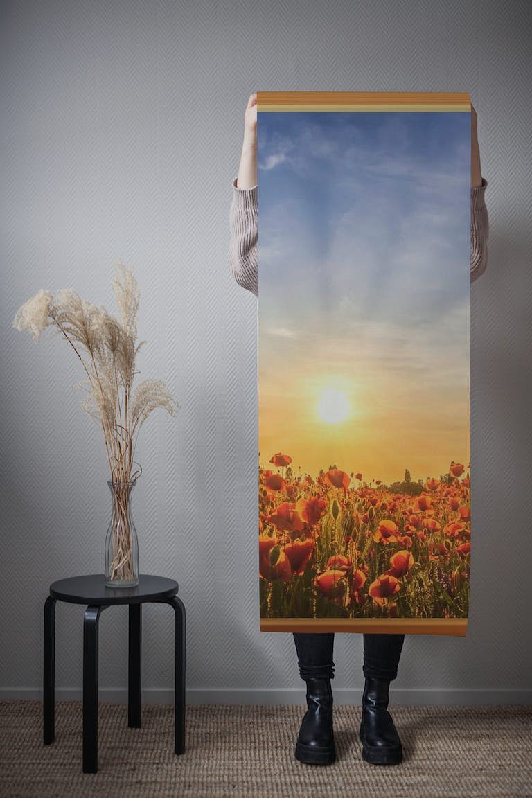 View of the setting sun in a poppy field behang roll
