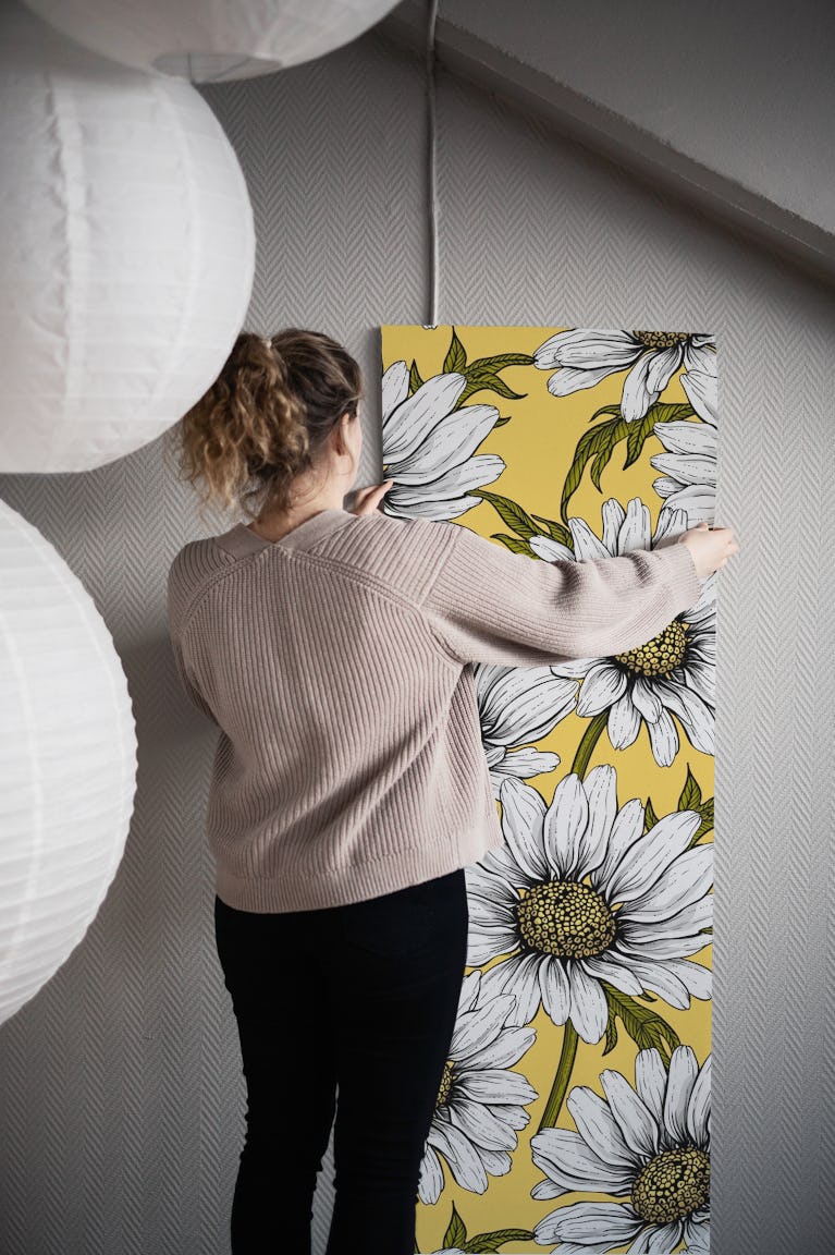 Daisies on yellow wallpaper roll