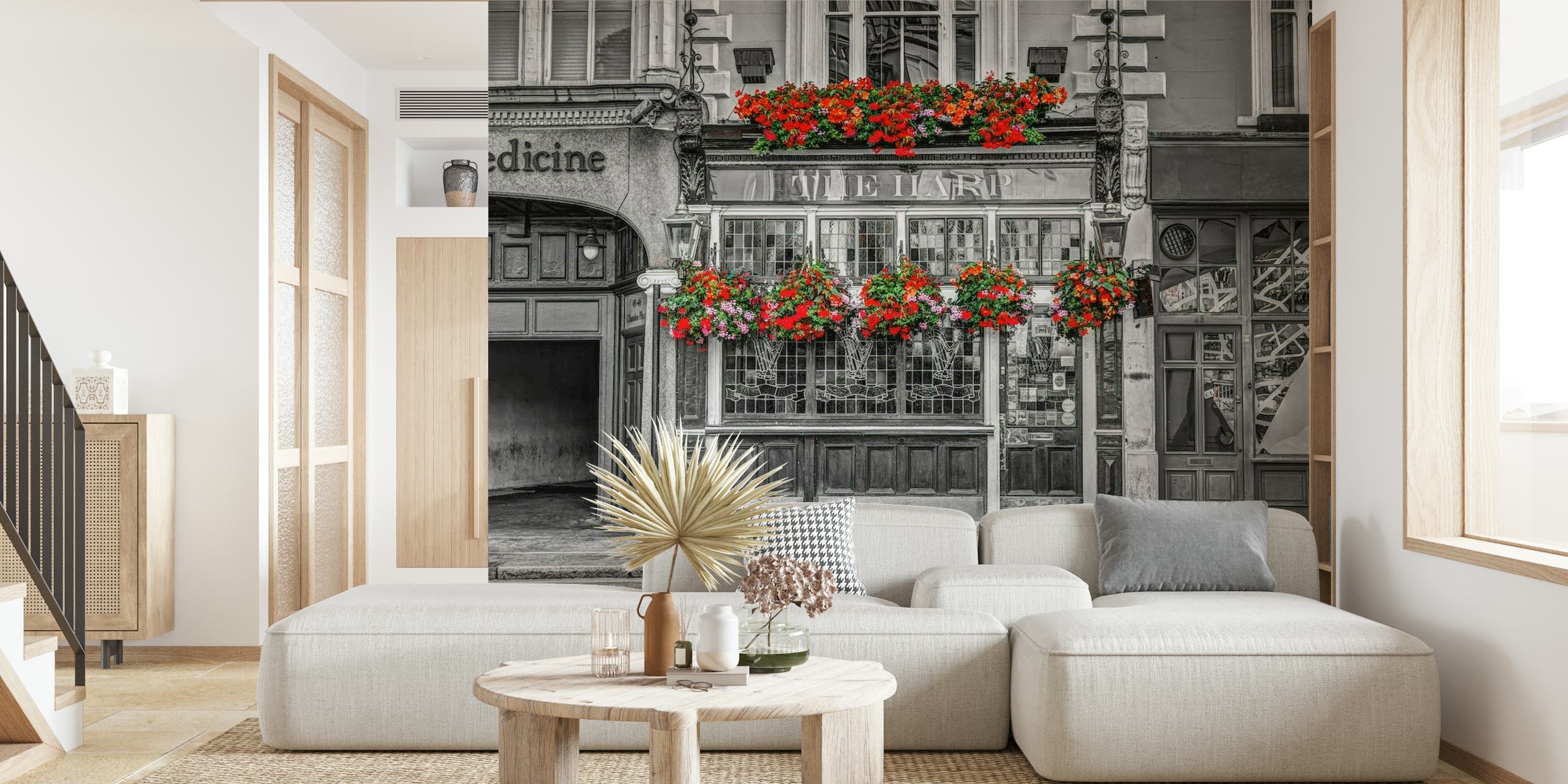 Klasyczna czarno-biała fasada brytyjskiego pubu z żywymi czerwonymi kwiatami, fototapeta