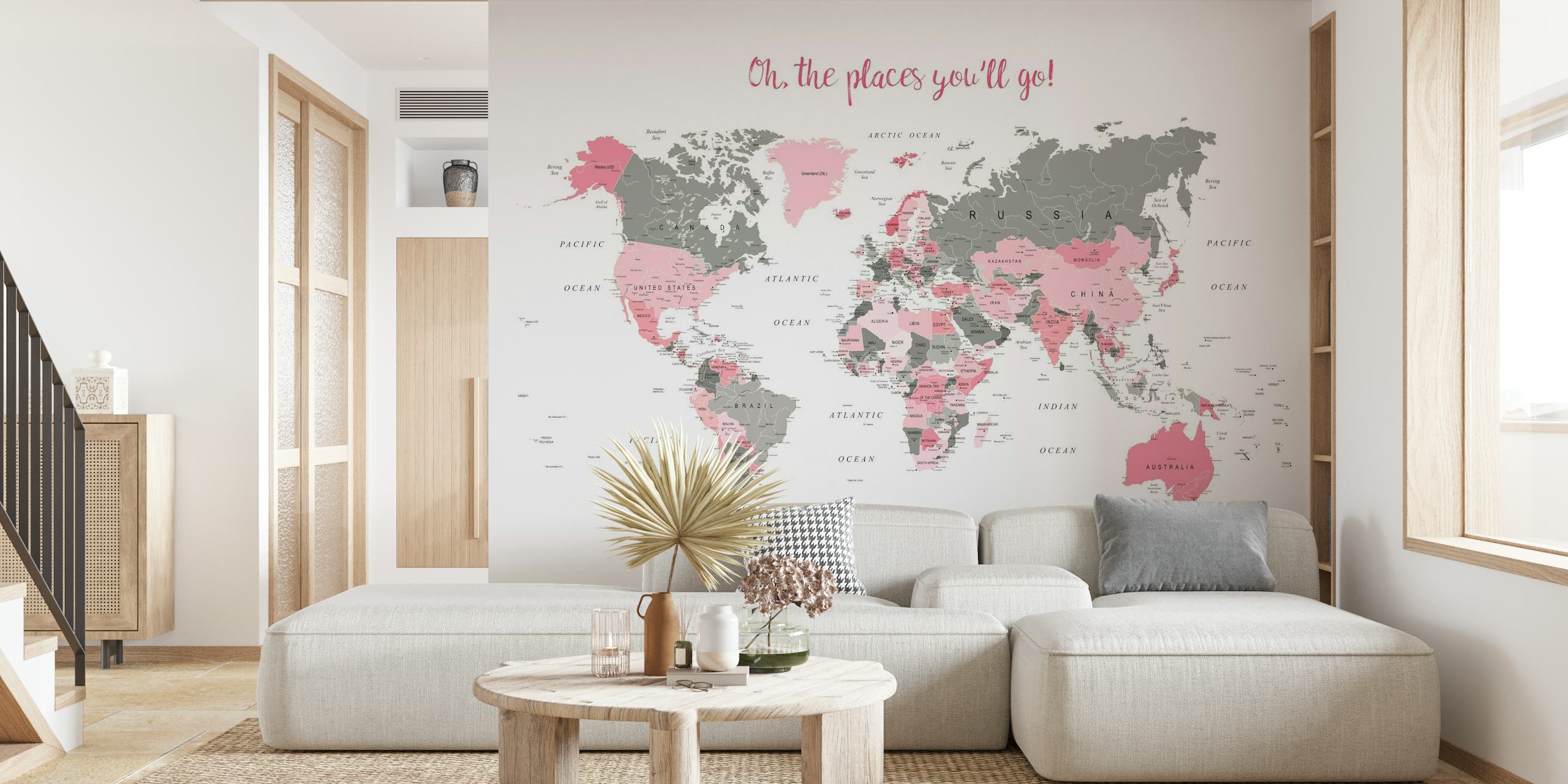 Stylish world map wall mural with pink highlights and phrase 'Oh The Places You'll Go!' for home decor.