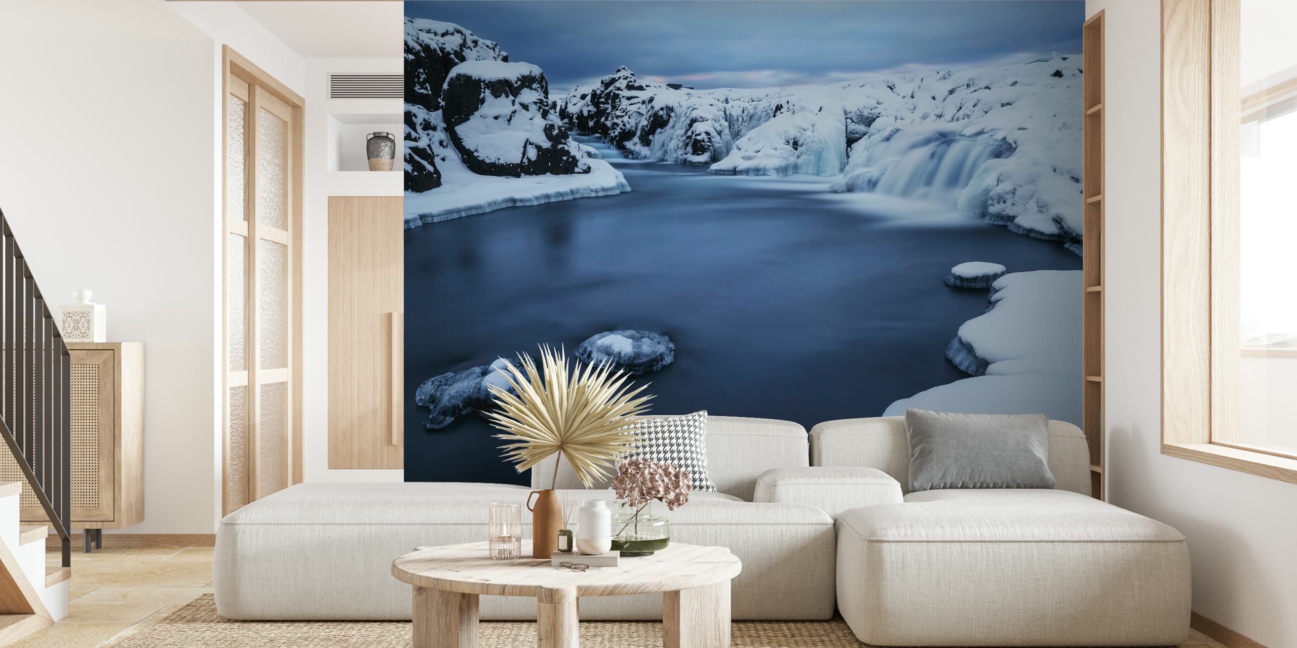 Icy blue river with rocks and snow wallpaper
