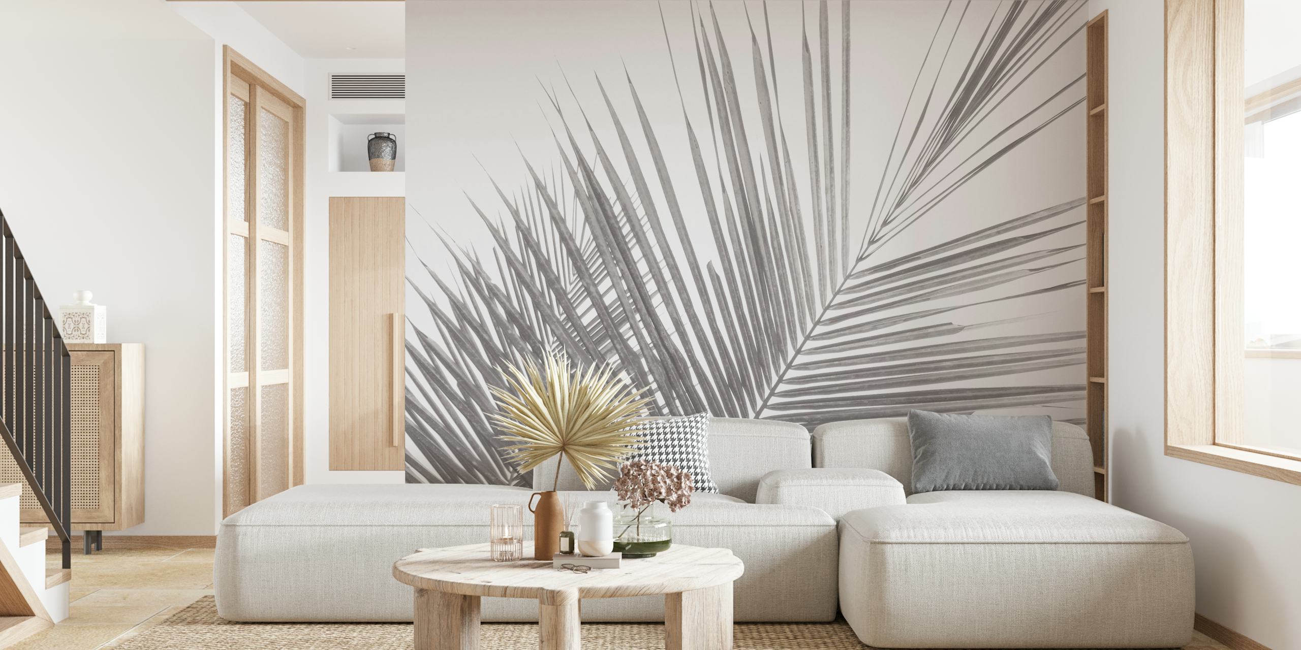 Monochrome tropical palm leaves wallpaper in a room