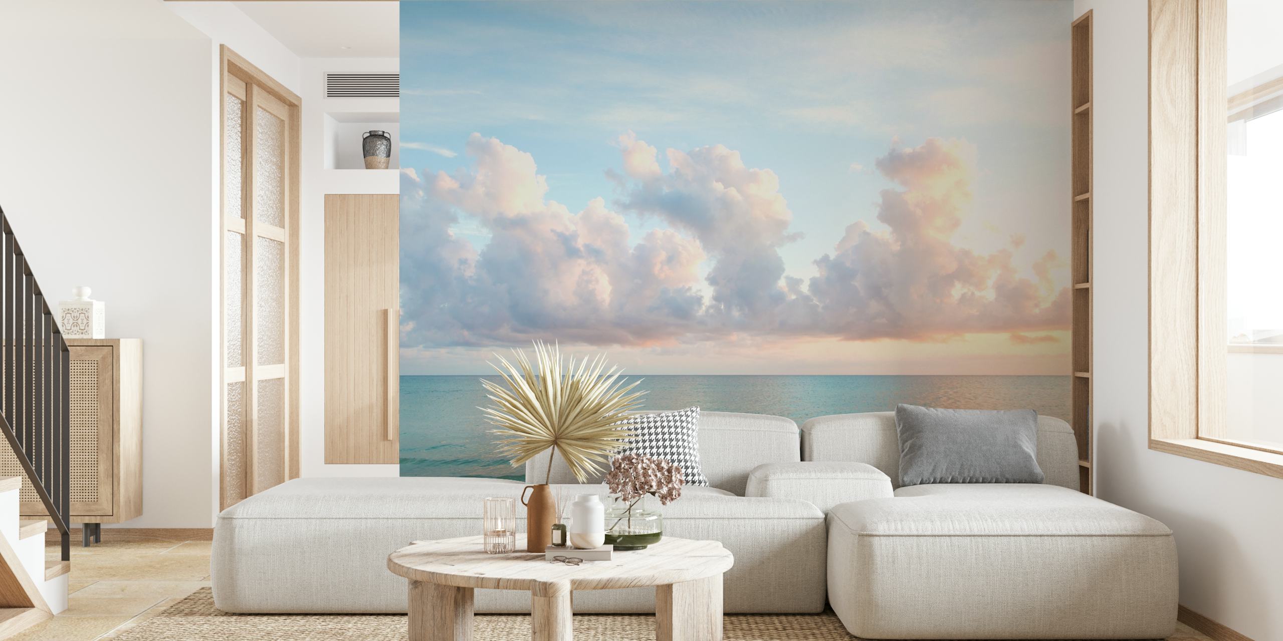 Blue ocean with gentle waves and soft pink clouds wallpaper