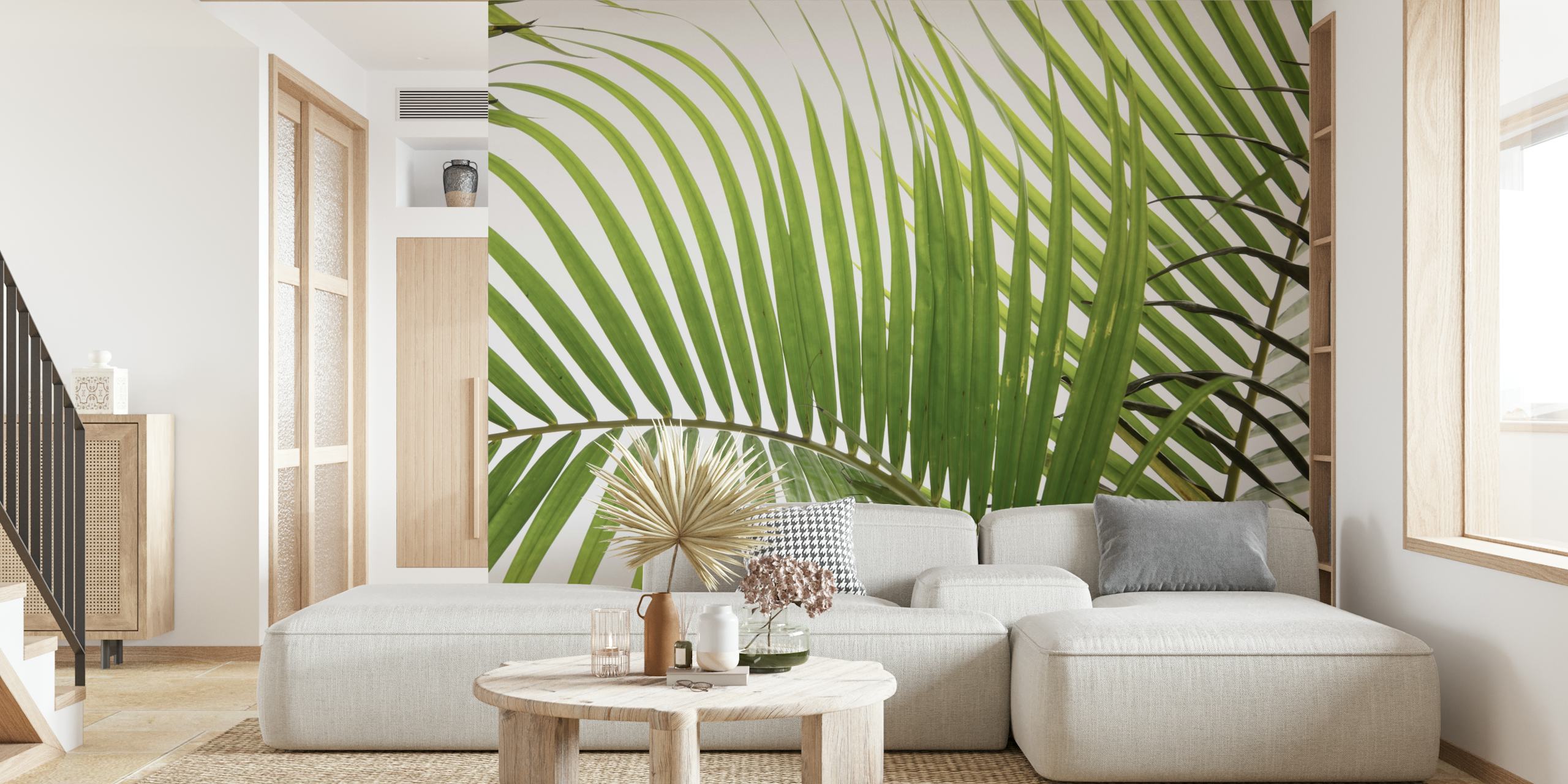Tropical palm leaves in green on a light background wallpaper