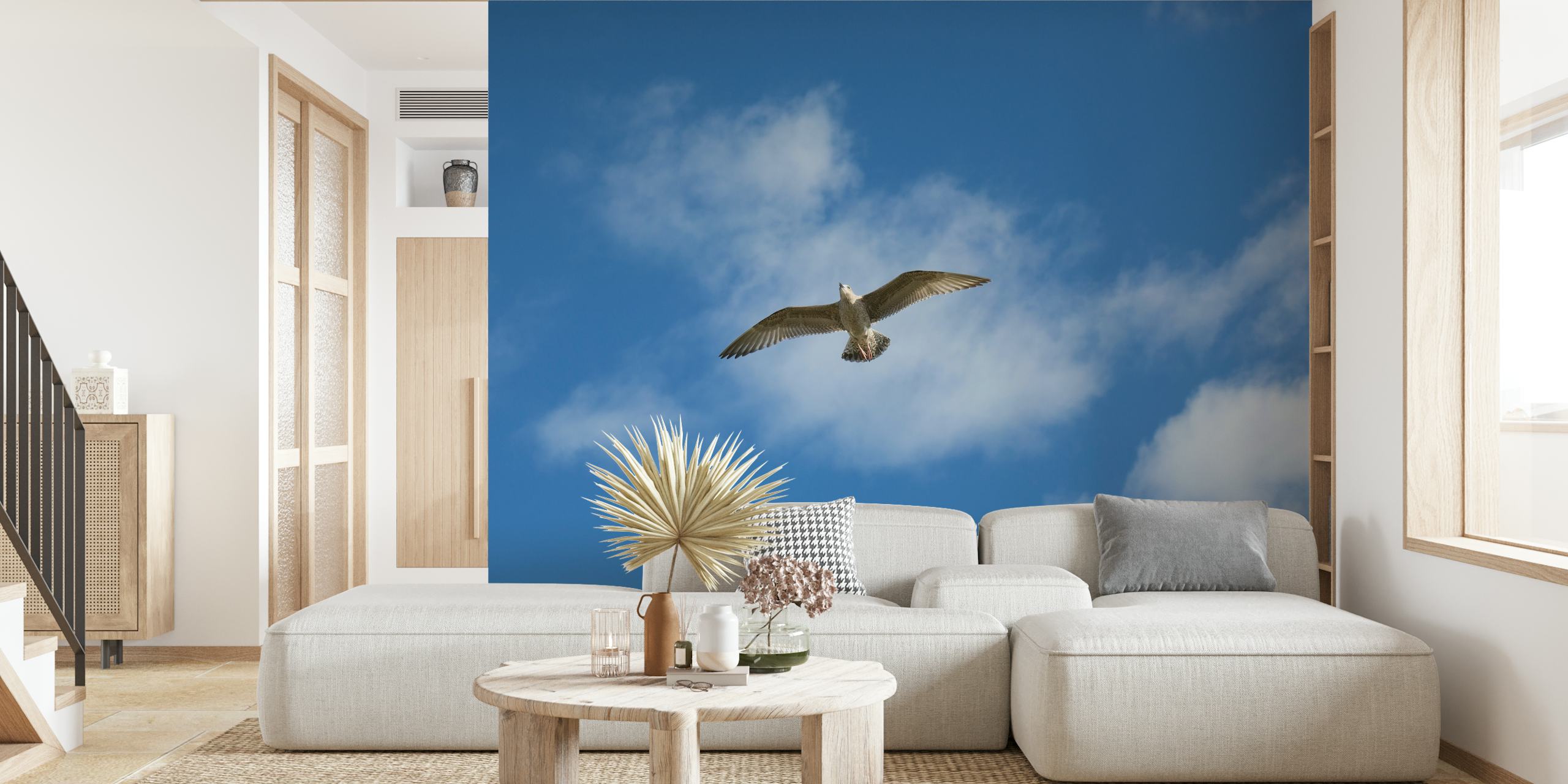 Sea gull soaring in blue sky with fluffy clouds wallpaper