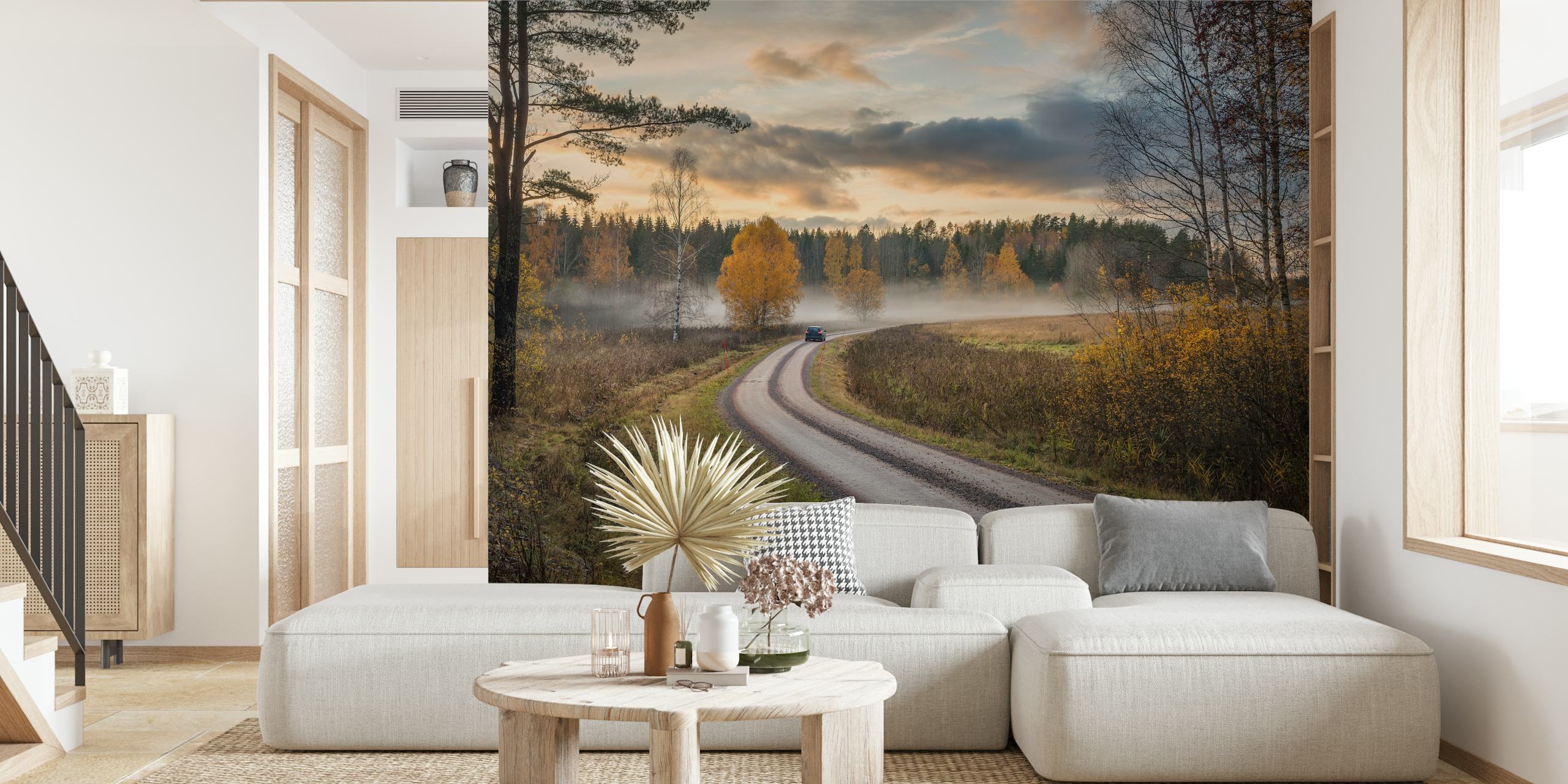 Autumn landscape wallpaper with winding road, yellow trees, and clouds
