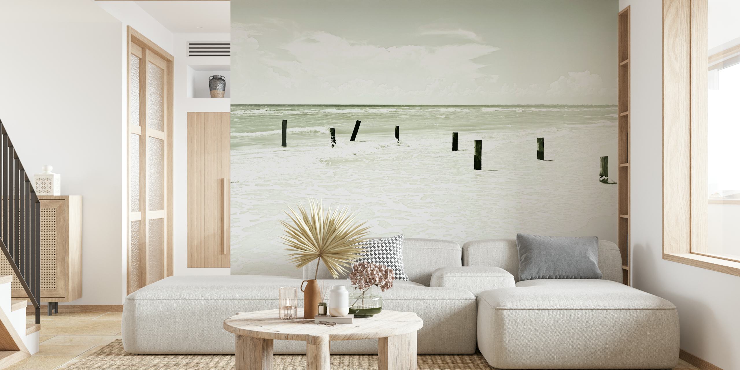 Black and white ocean view wallpaper with broken posts on sandy shore