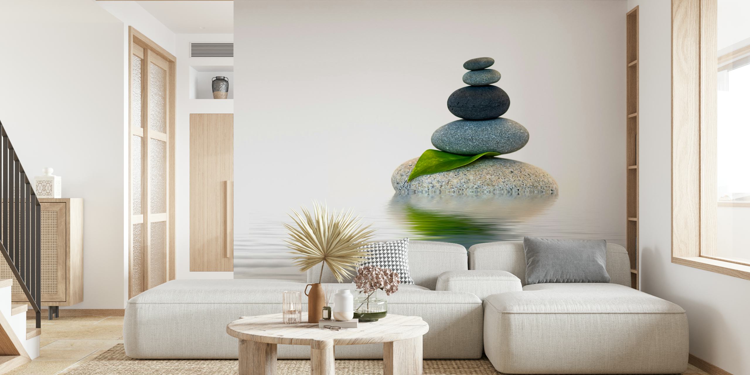 Zen stone stack with leaf wall mural on a serene water background
