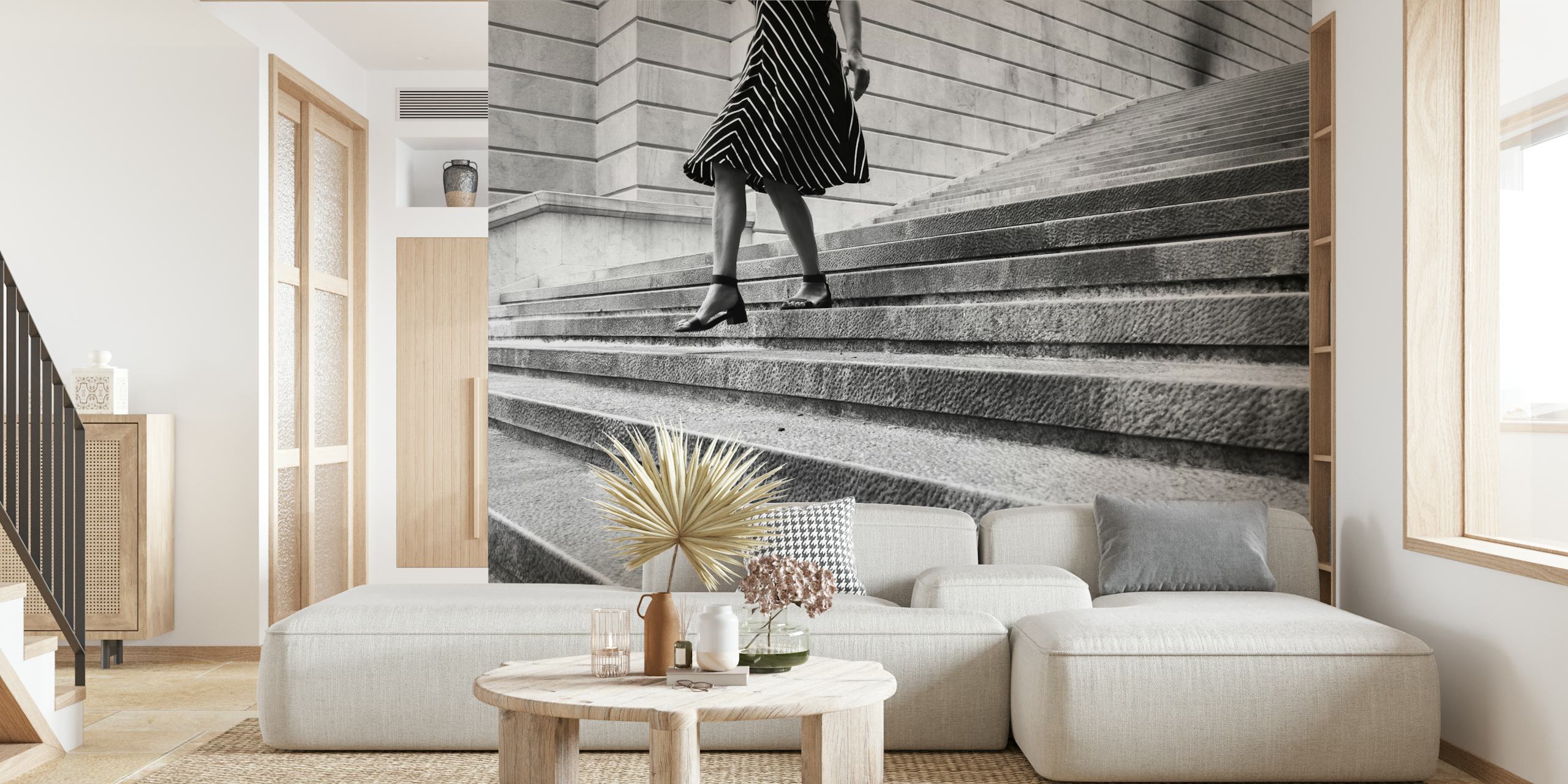 Monochrome image of a person walking up stairs in striped clothing for Escape Myself mural