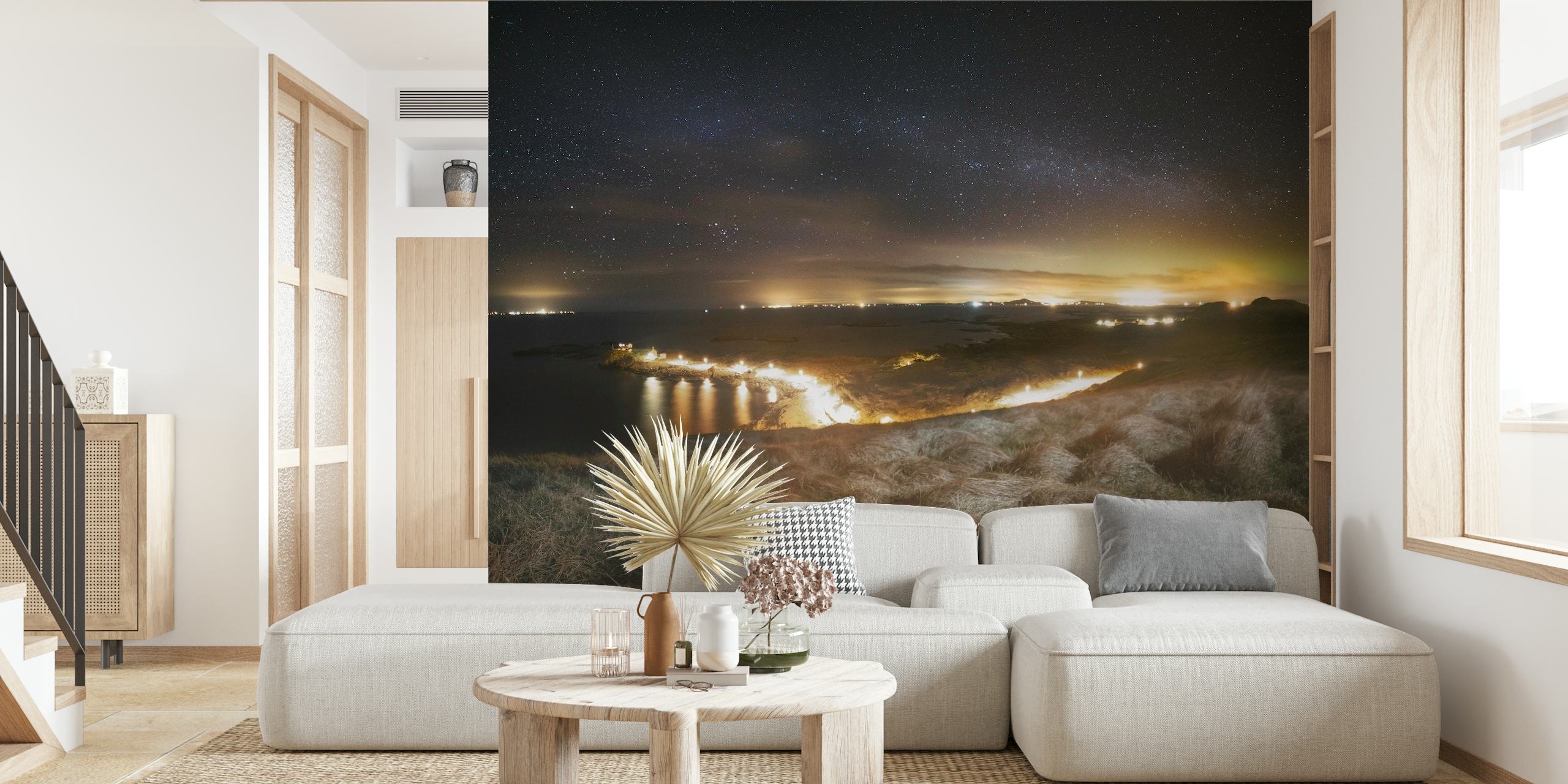 Nighttime landscape featuring twinkling stars over a tranquil town