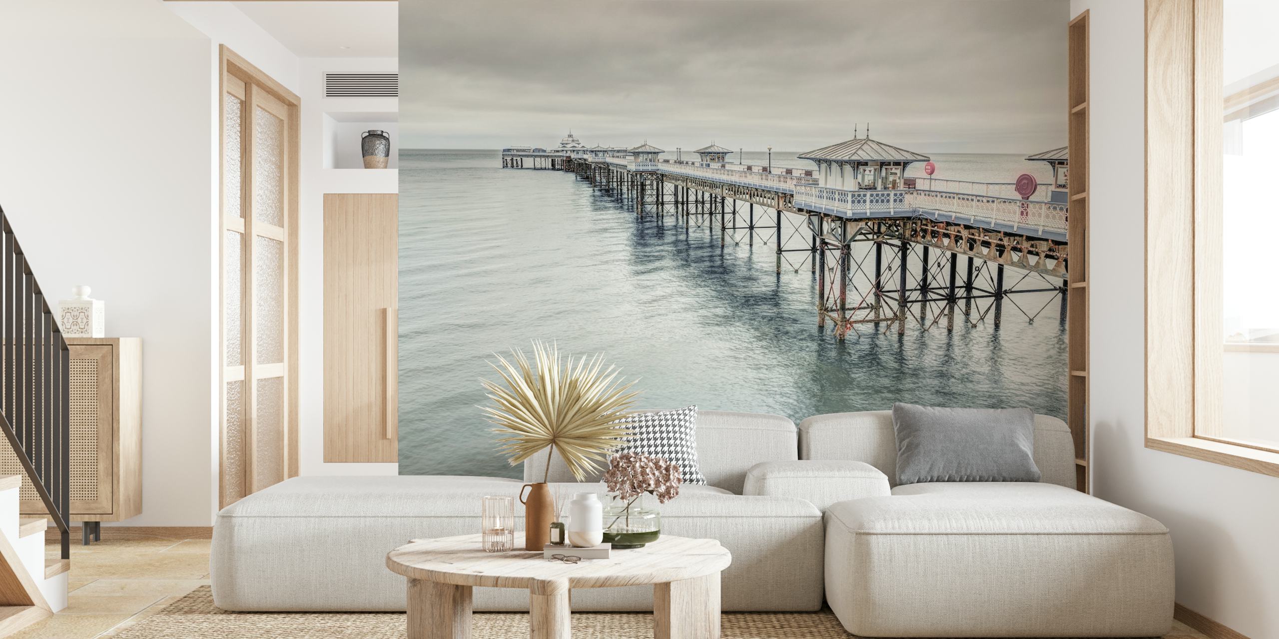 Coastal landscape wallpaper featuring Llandudno pier in muted greys and blues, realistic photography style.
