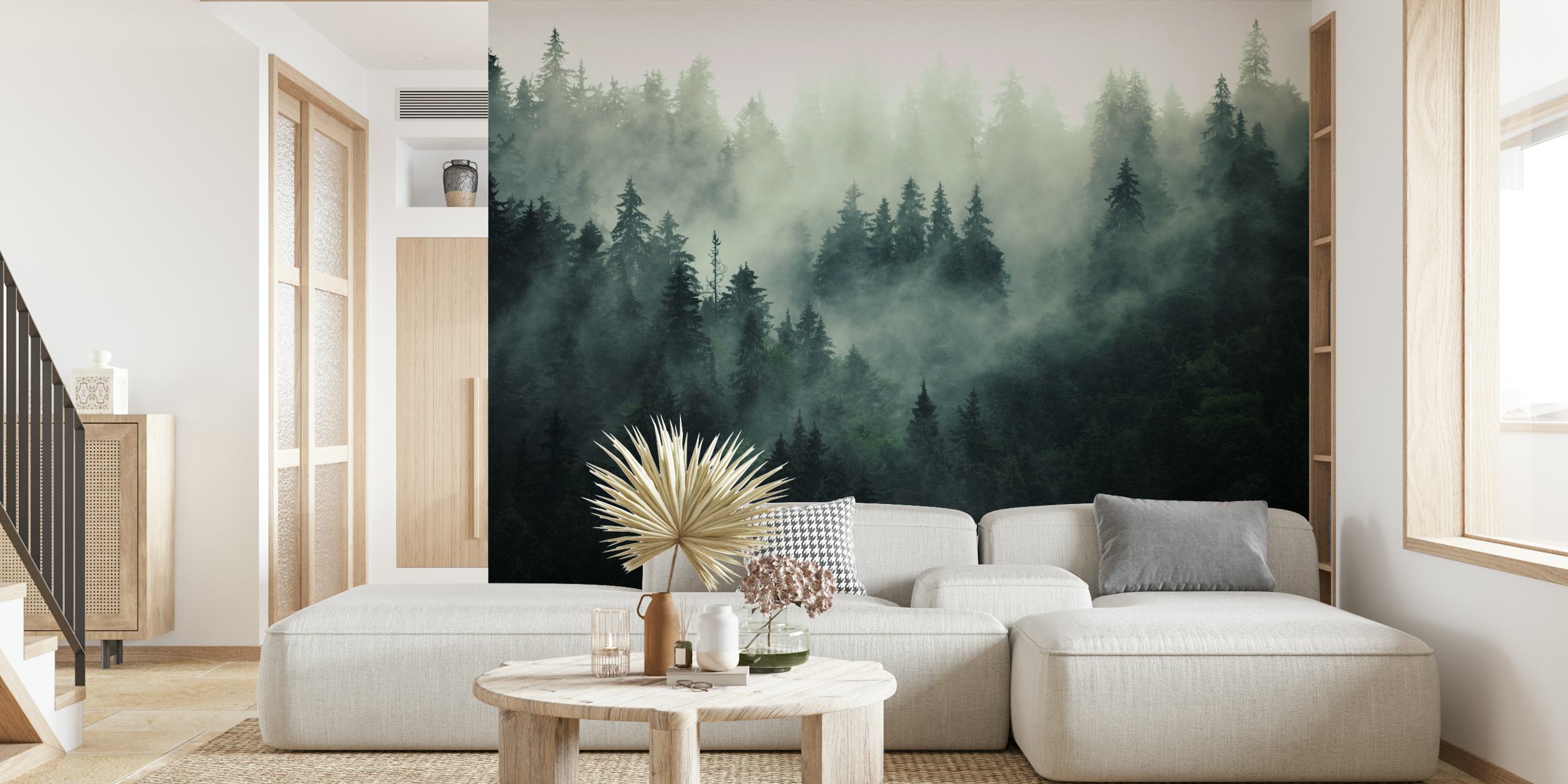 Misty forest scene with tall evergreen trees and fog wallpaper