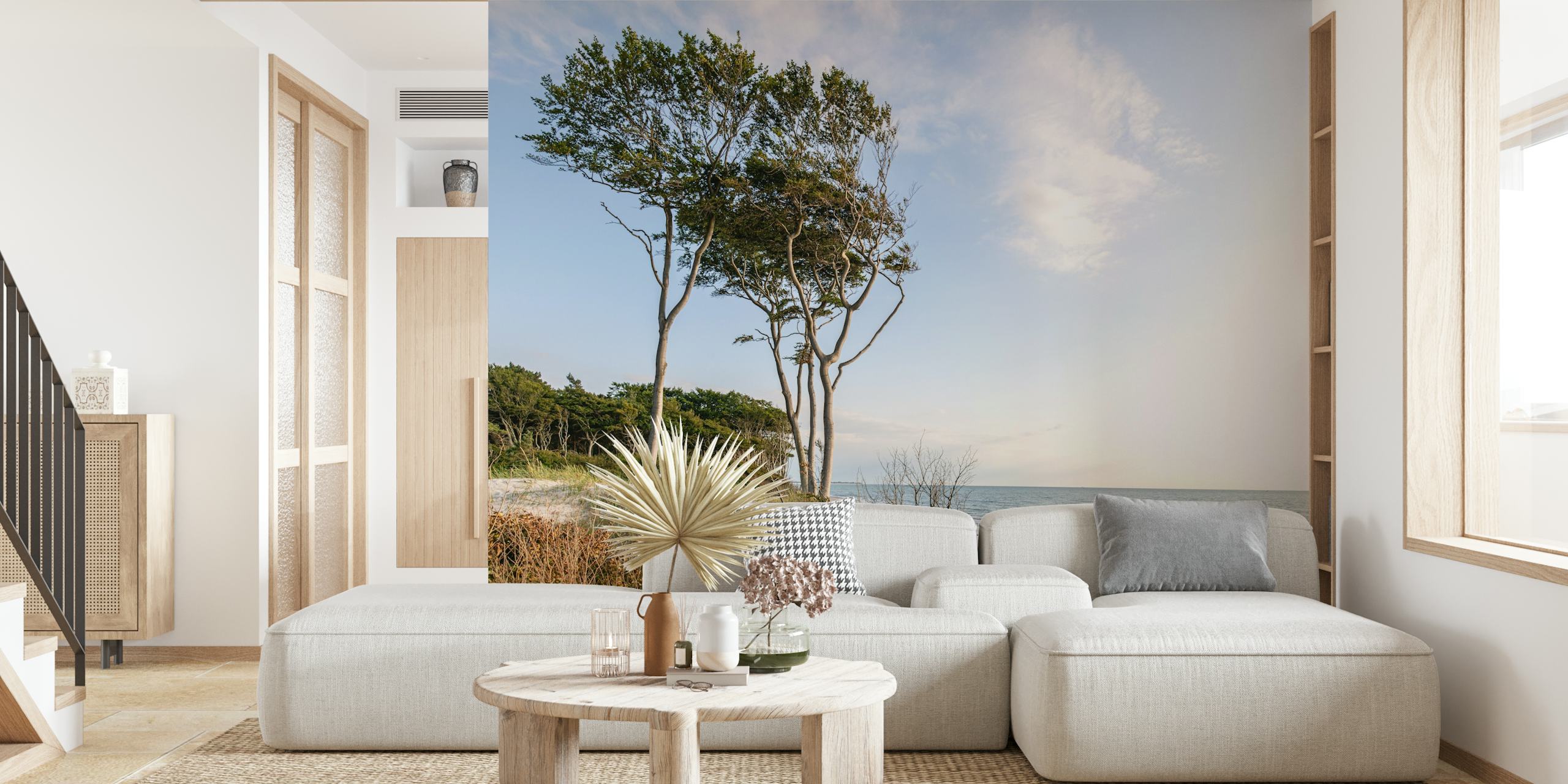 Trees on a beach with soft blue ocean and sky wallpaper