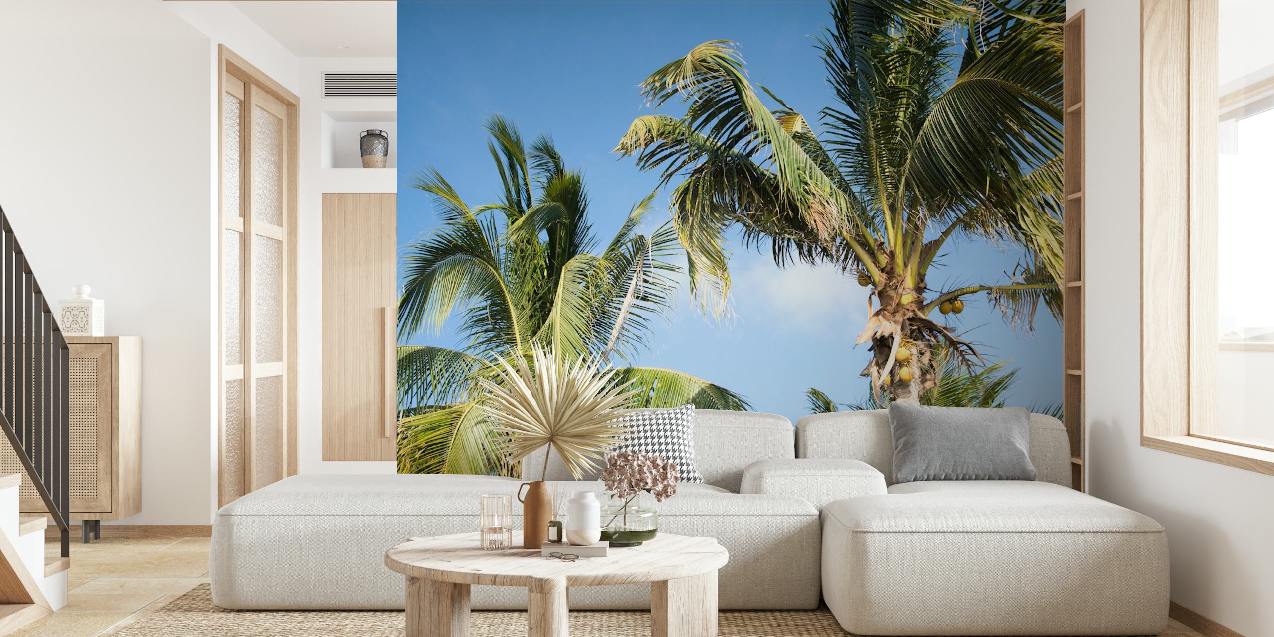 Tropical palm leaves against a clear blue sky wallpaper