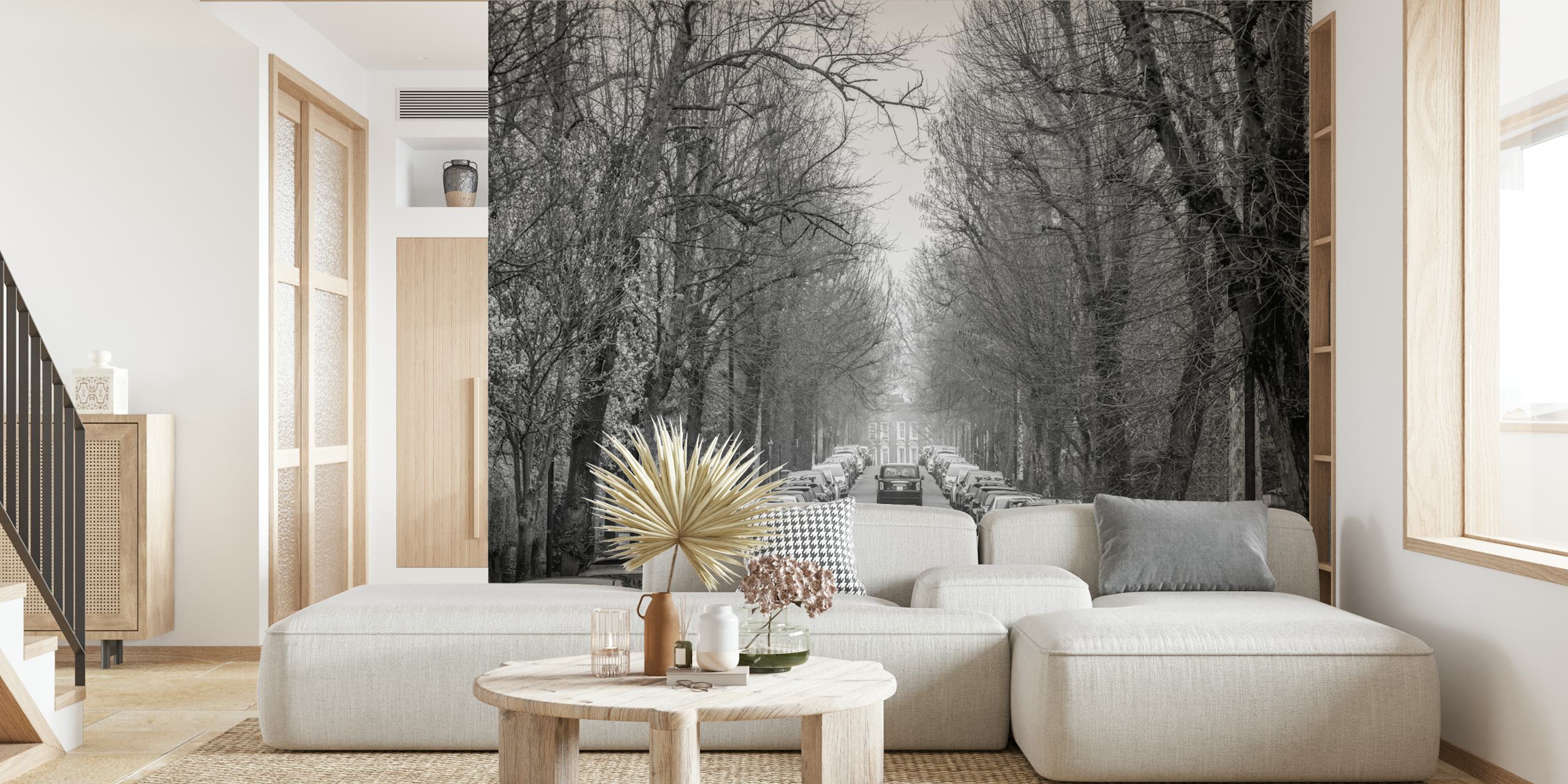 Black and white mural of a London taxi on a tree-lined road with classic elegance.