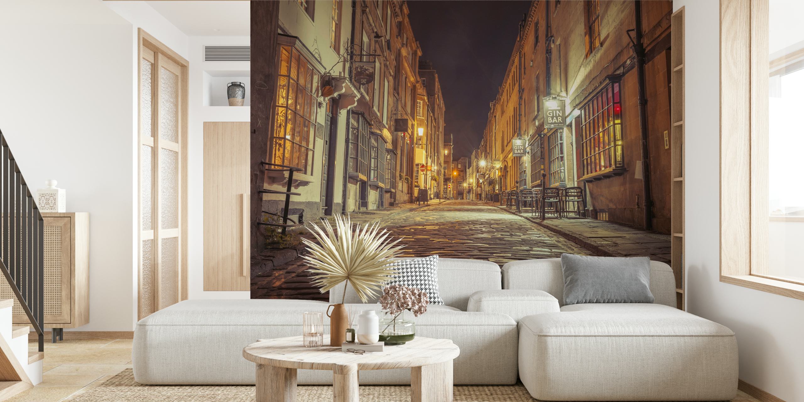 Cobblestone street at night with warm lights wallpaper
