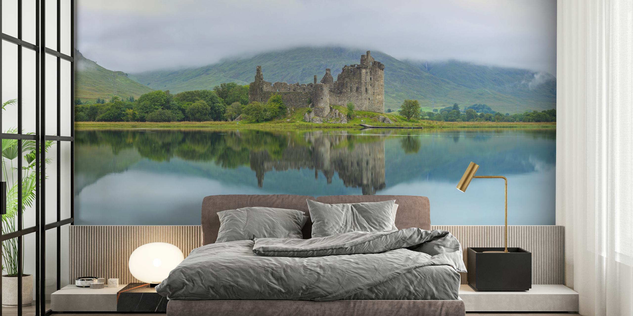 Kilchurn Castle reflecting in tranquil water surrounded by green hills wallpaper