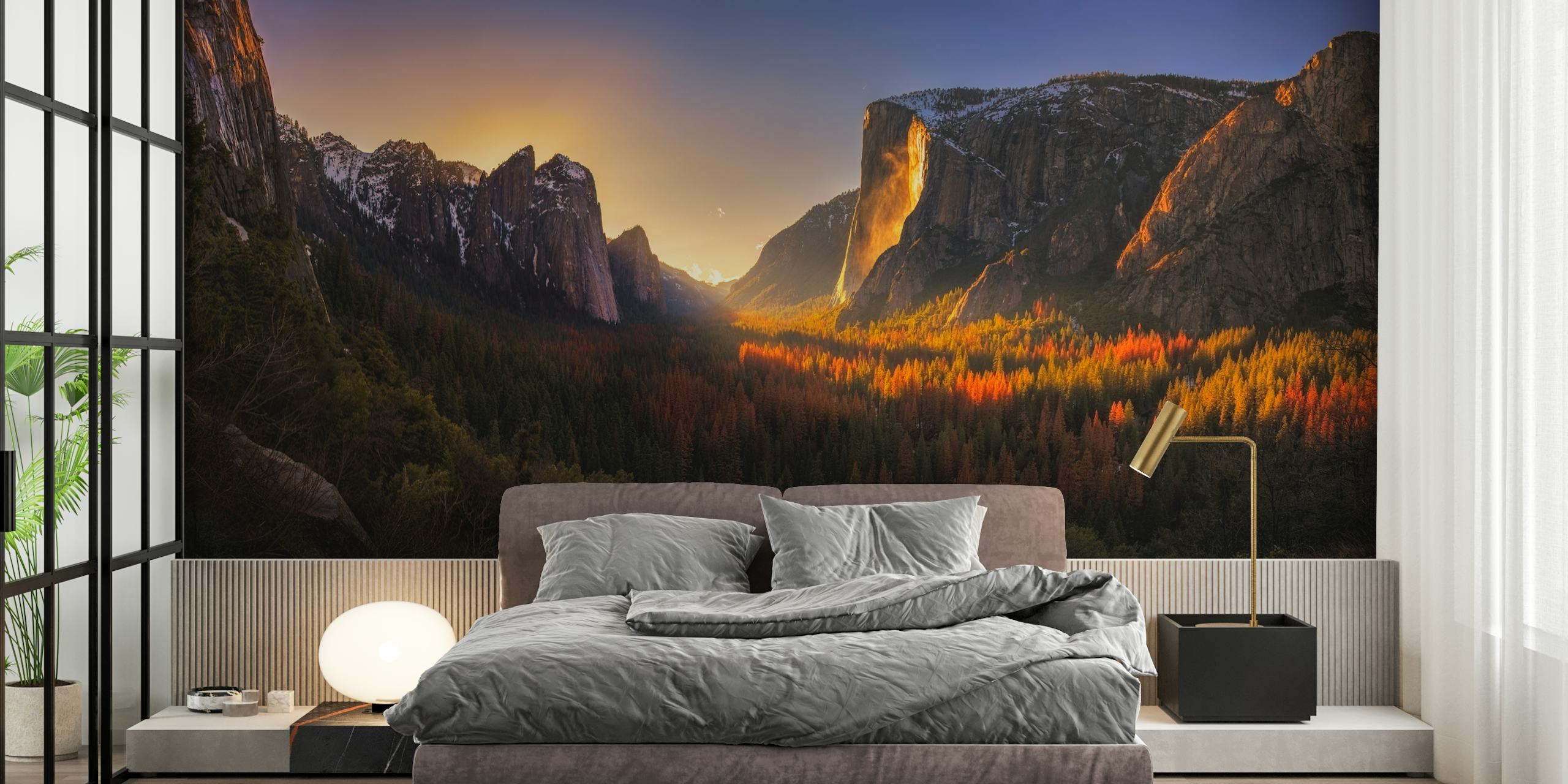 A vivid sunset over Yosemite's Firefall, showcasing red, orange, and gold tones against majestic mountains. Nature wallpaper