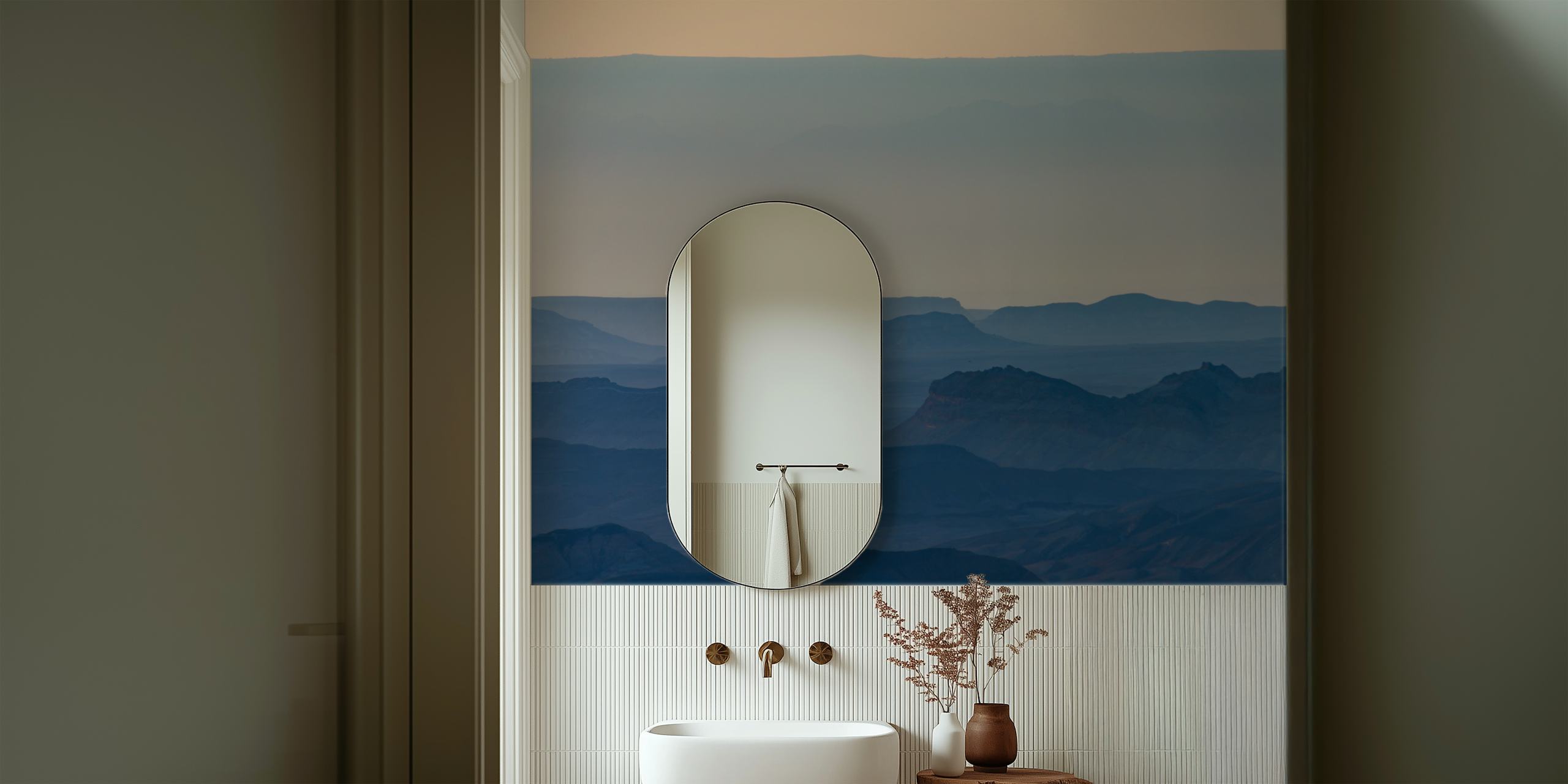 Landscape wallpaper featuring sunrise over mountains in soft blue hues