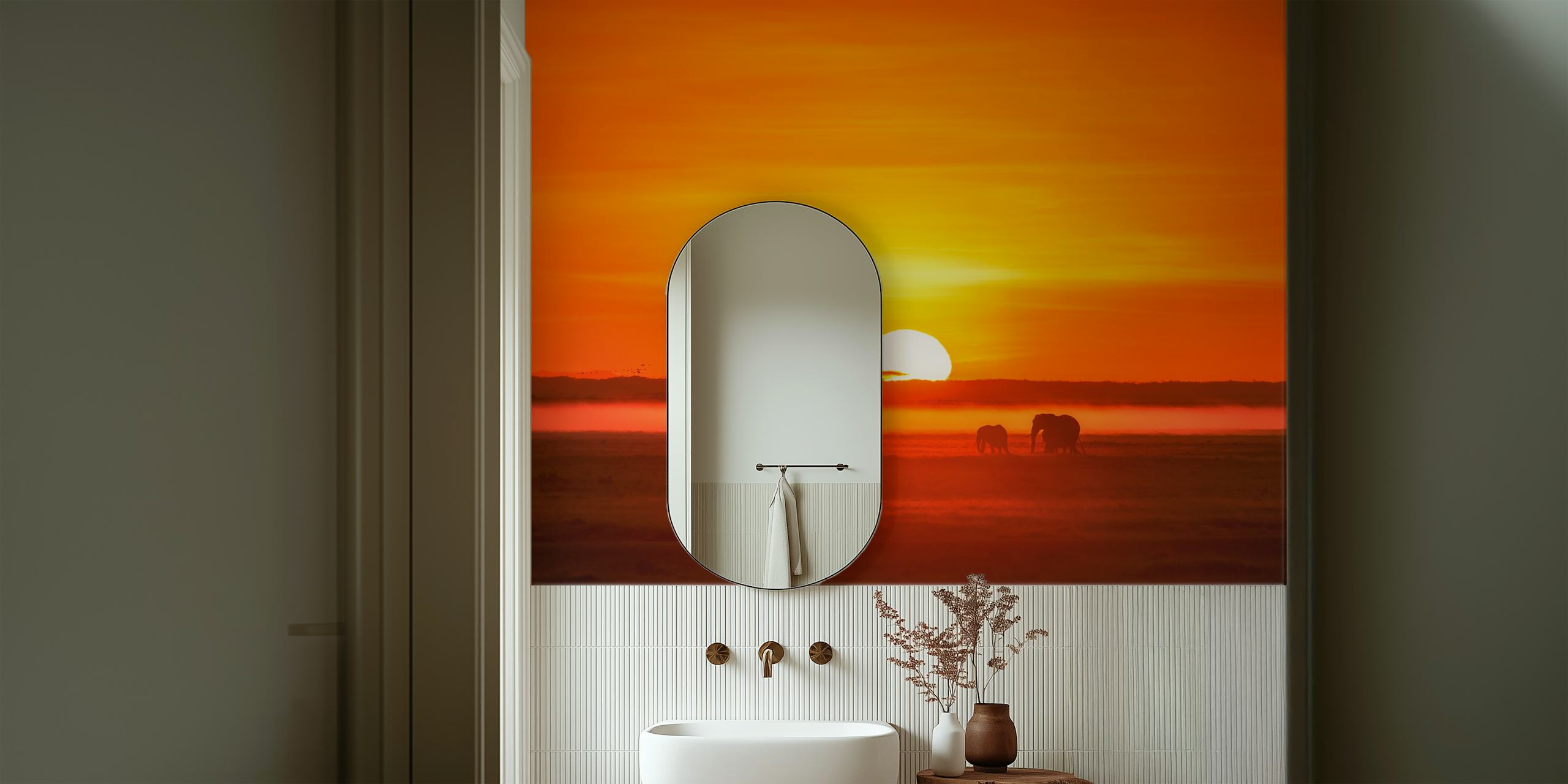 Silhouettes of elephants against vibrant orange sunset wallpaper