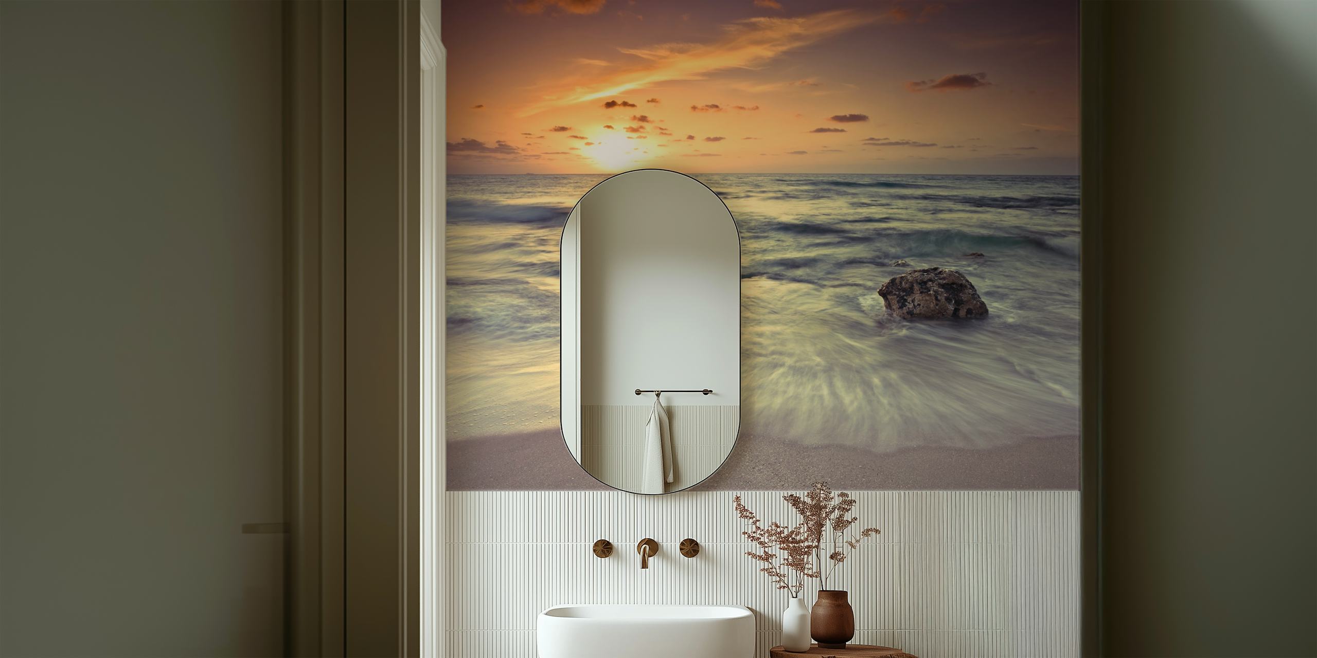 Beach sunset with waves and rock in golden hues wallpaper