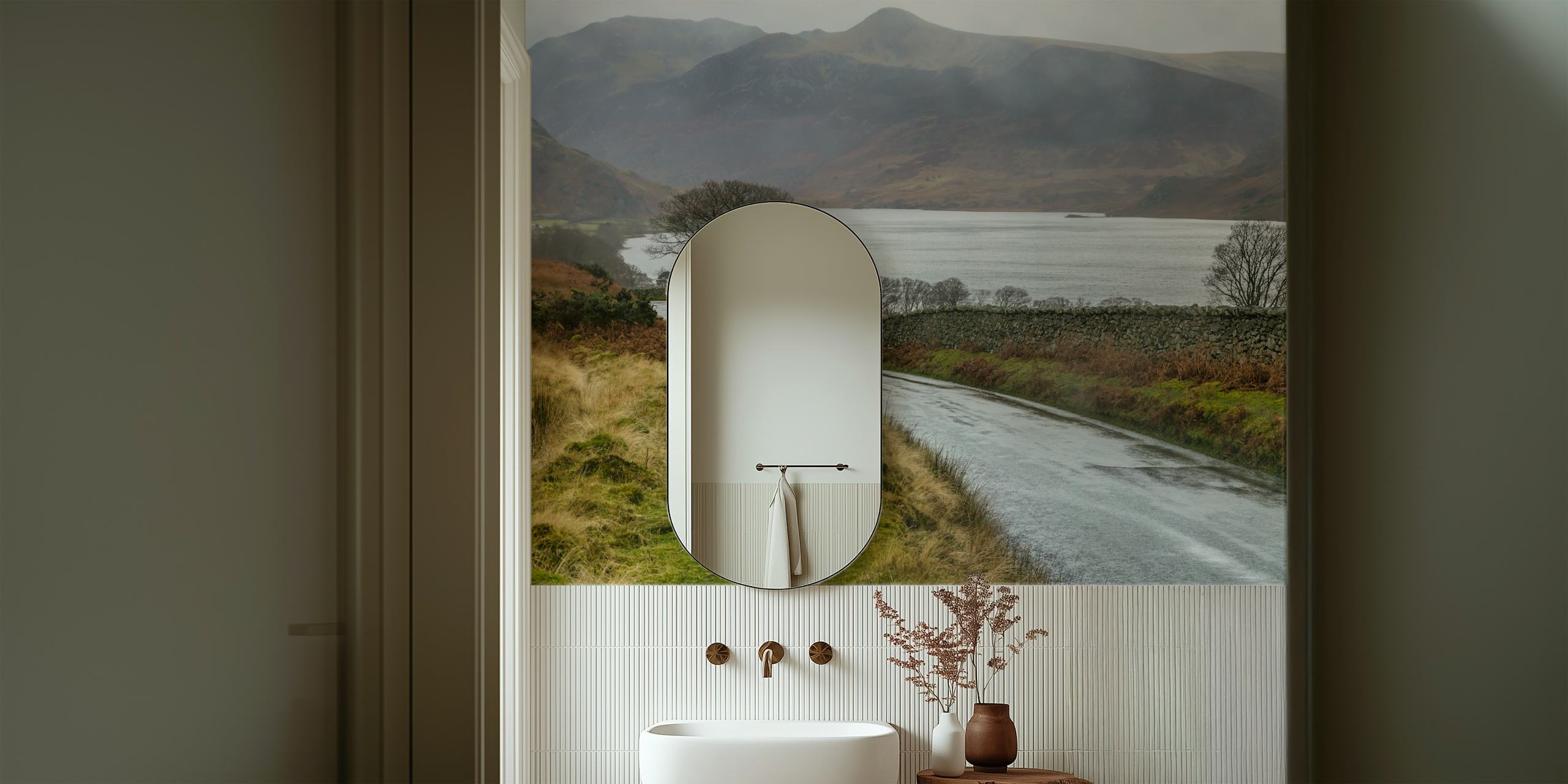 British Lake District countryside with winding road beside a serene lake