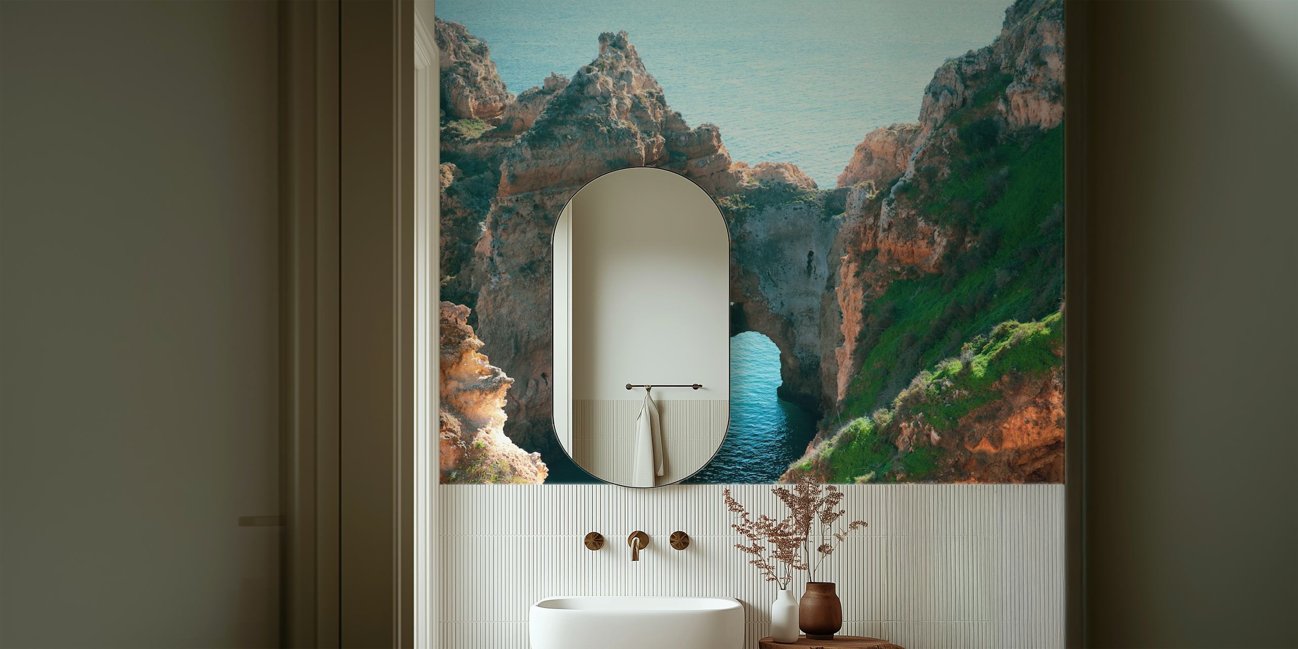 Coastal rock formations with blue water and green grass wallpaper