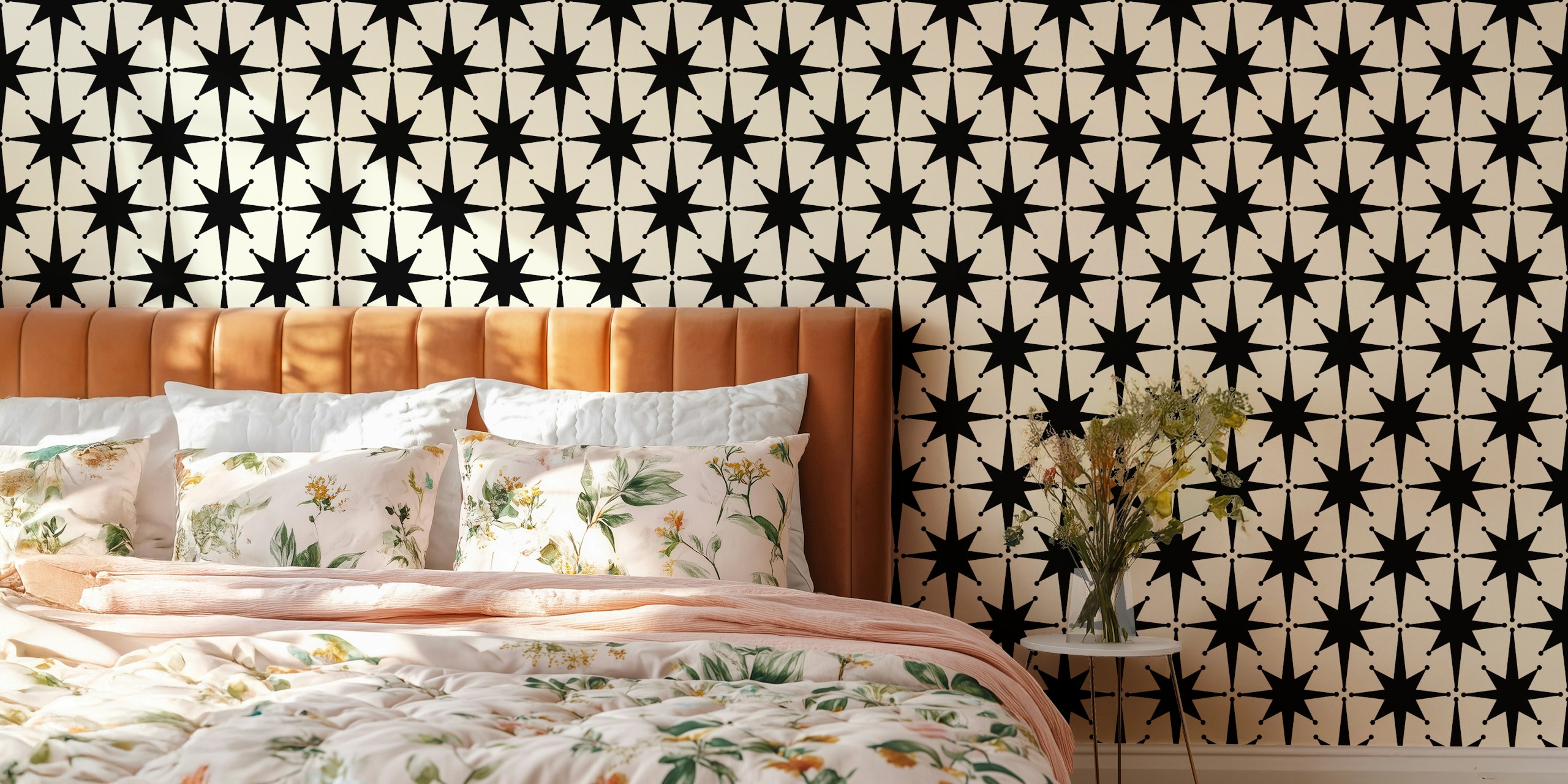 Black starburst shapes on cream background wallpaper