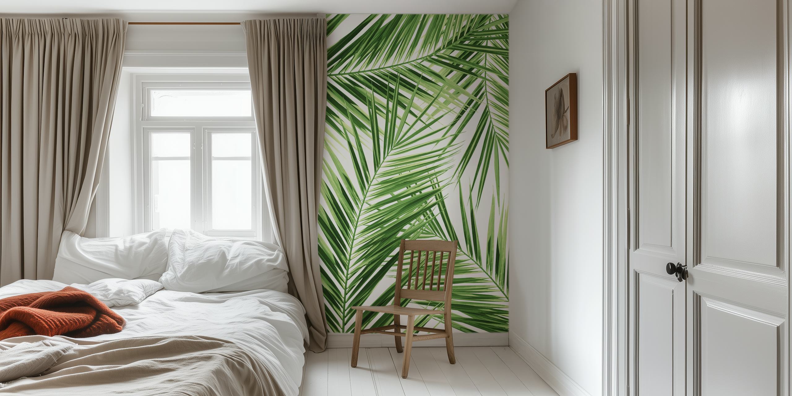 Tropical palm leaves in green tones on white background wallpaper
