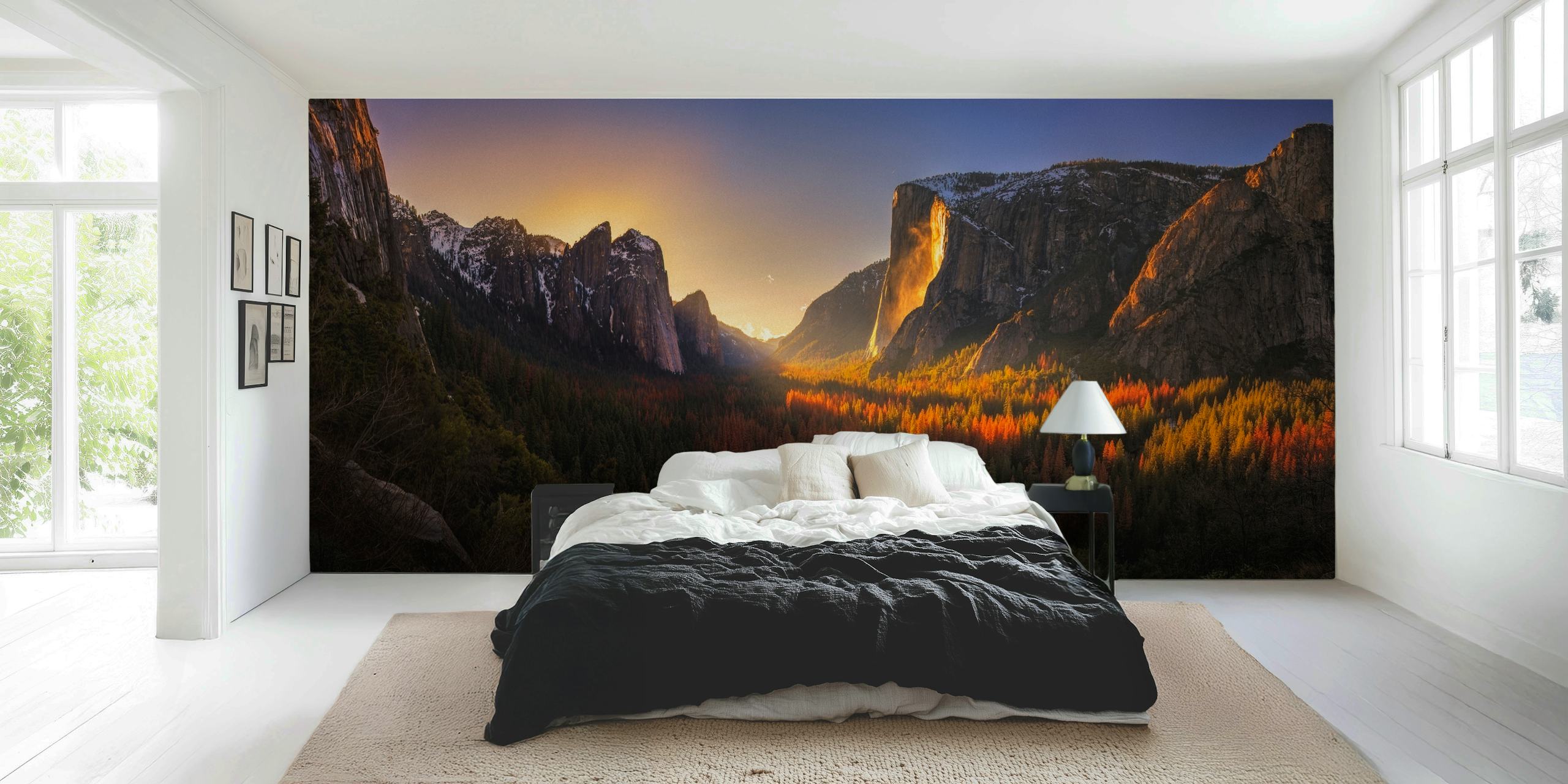 A vivid sunset over Yosemite's Firefall, showcasing red, orange, and gold tones against majestic mountains. Nature wallpaper