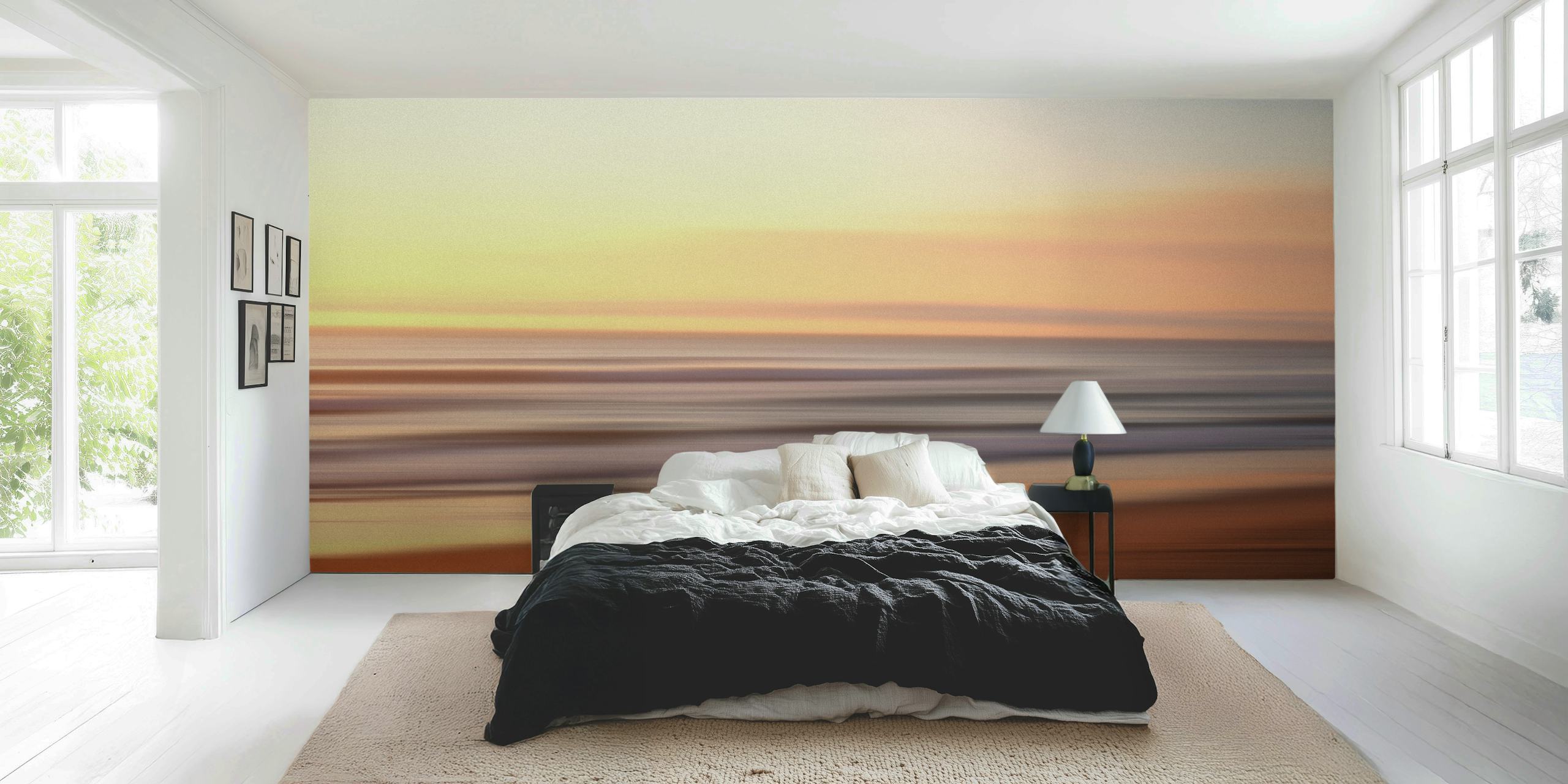 Blurred ocean sunset with orange and blue hues wallpaper