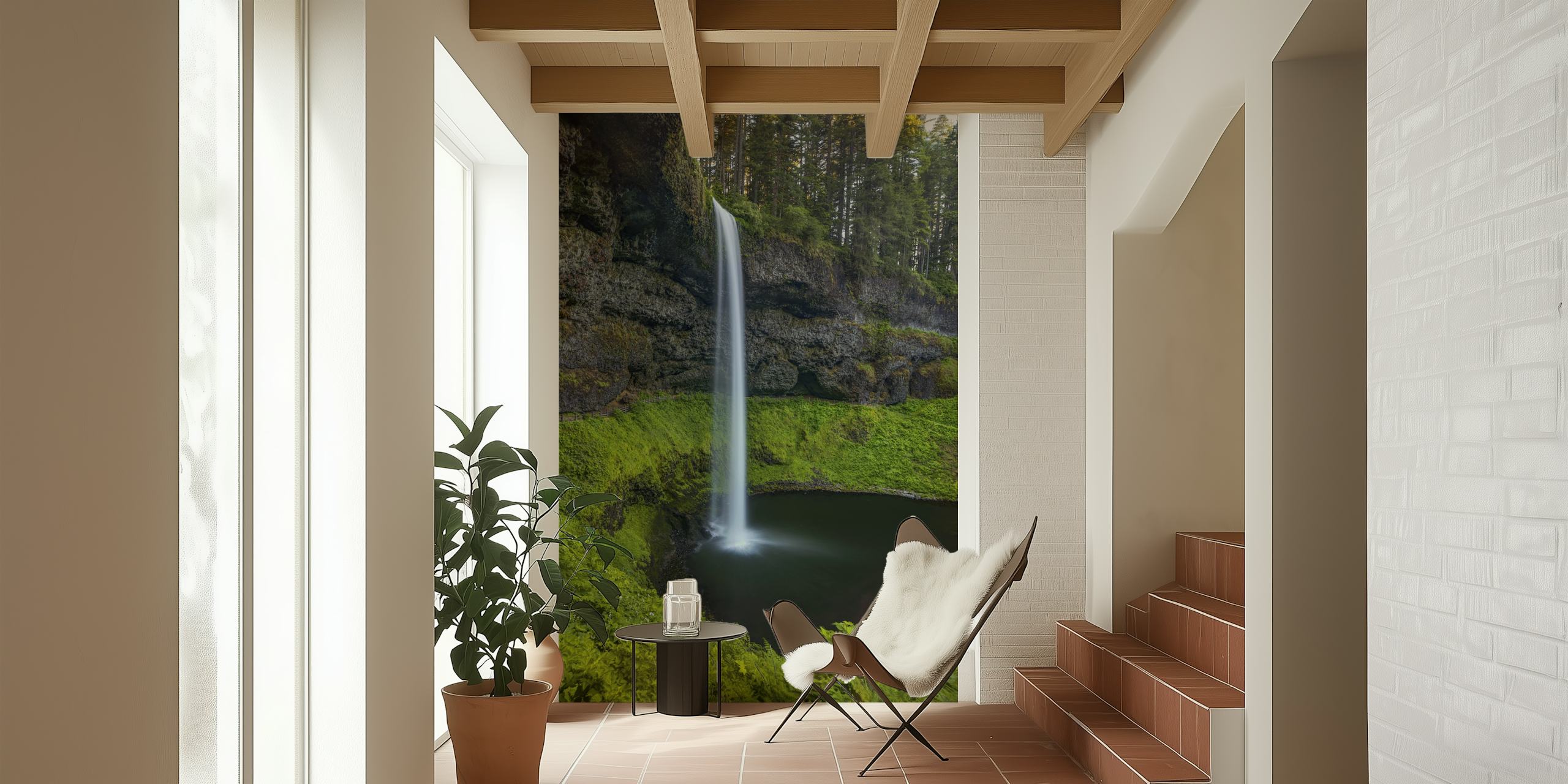 Waterfall surrounded by green foliage and rocky cliffs wallpaper