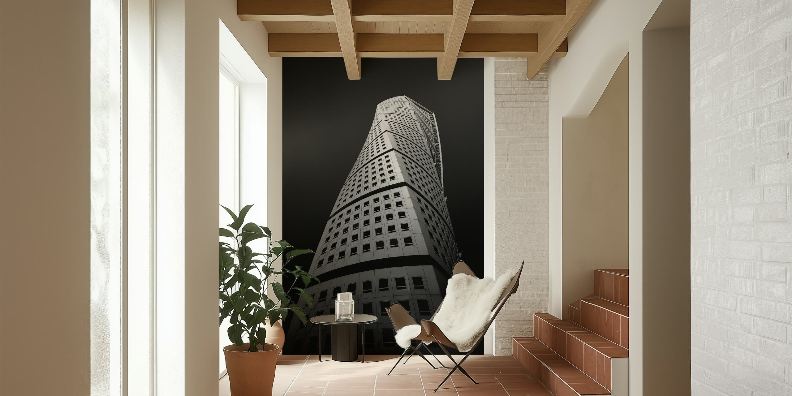 Monochrome wall mural of a twisting skyscraper against a dark sky