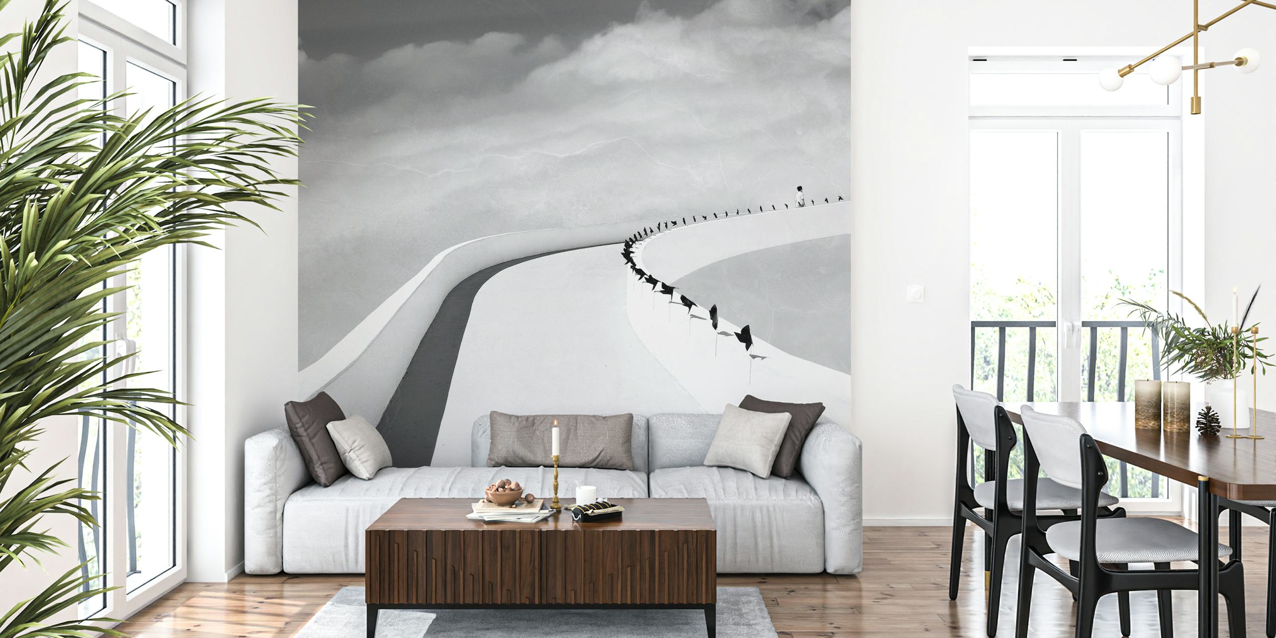 Monochrome wall mural with people on a winding road leading to the horizon