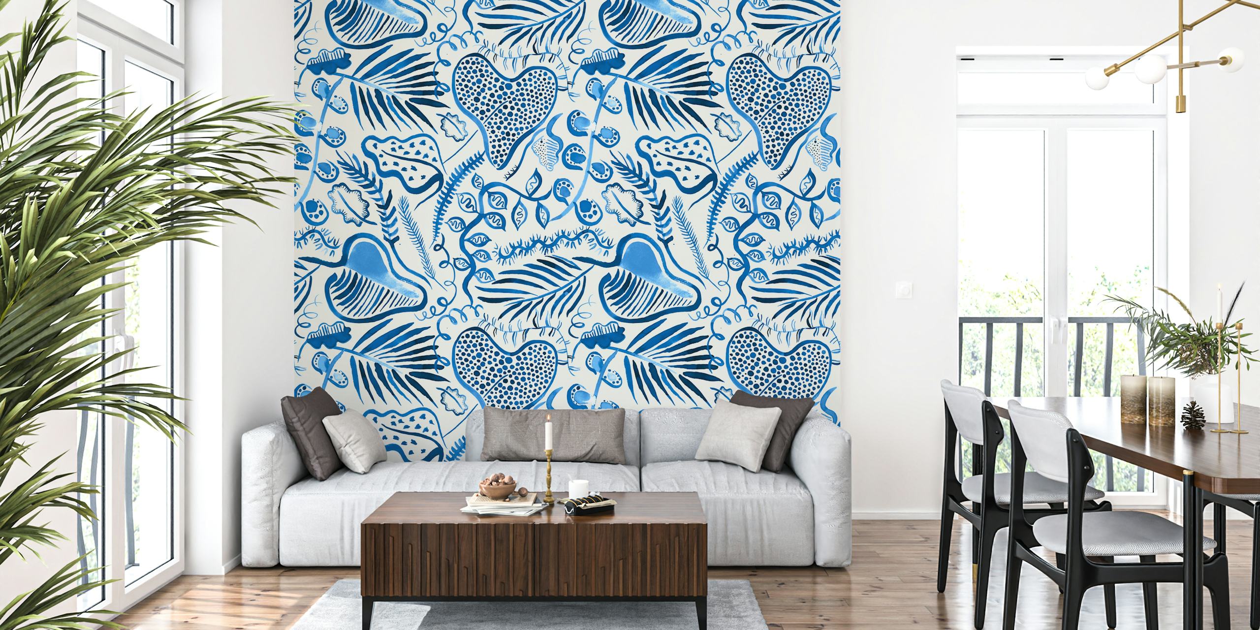 Tropical leaves in blue tones on a light background wallpaper