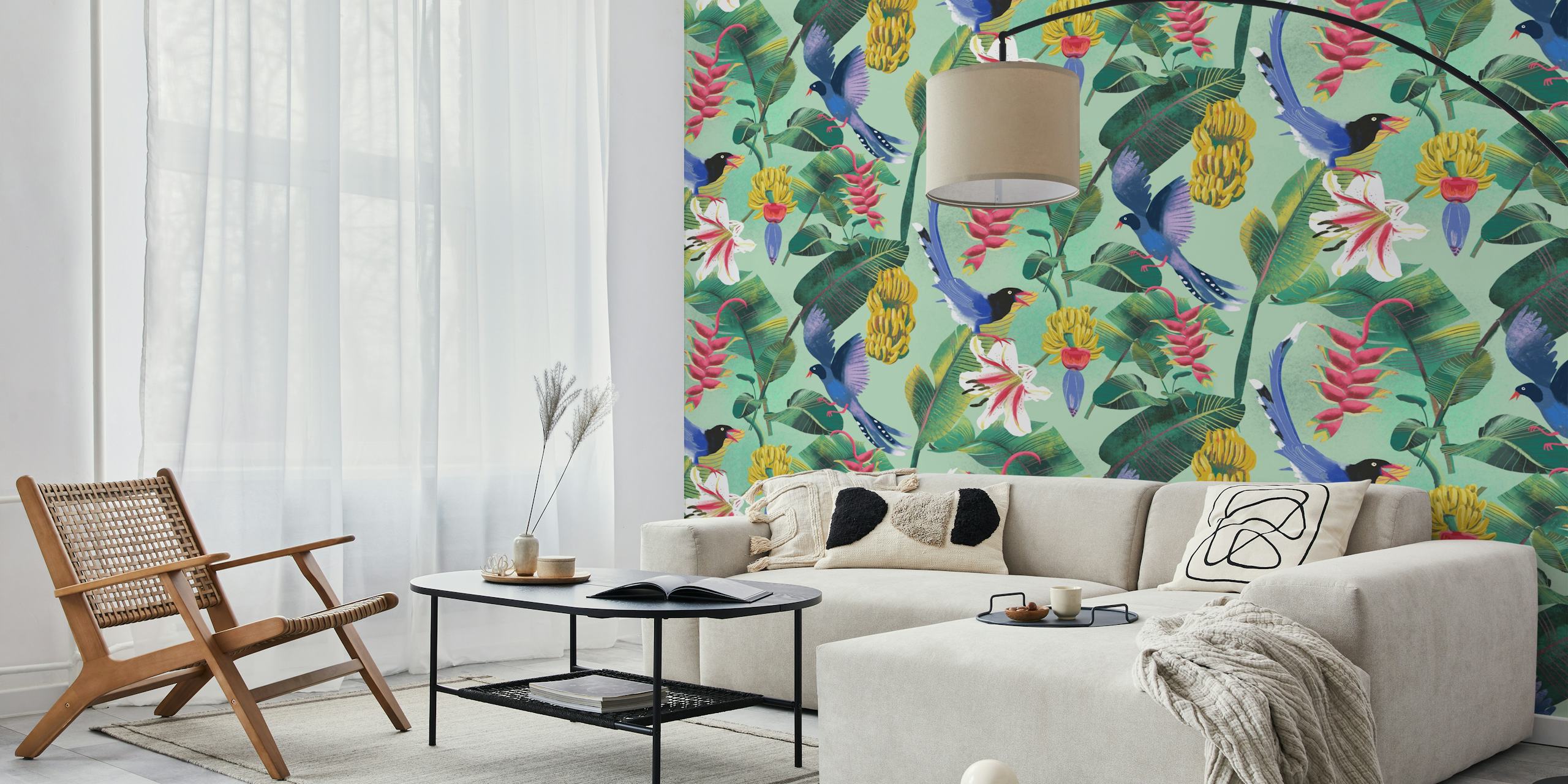 Tropical jungle wallpaper with blue birds, pink flowers, green leaves on a mint background.