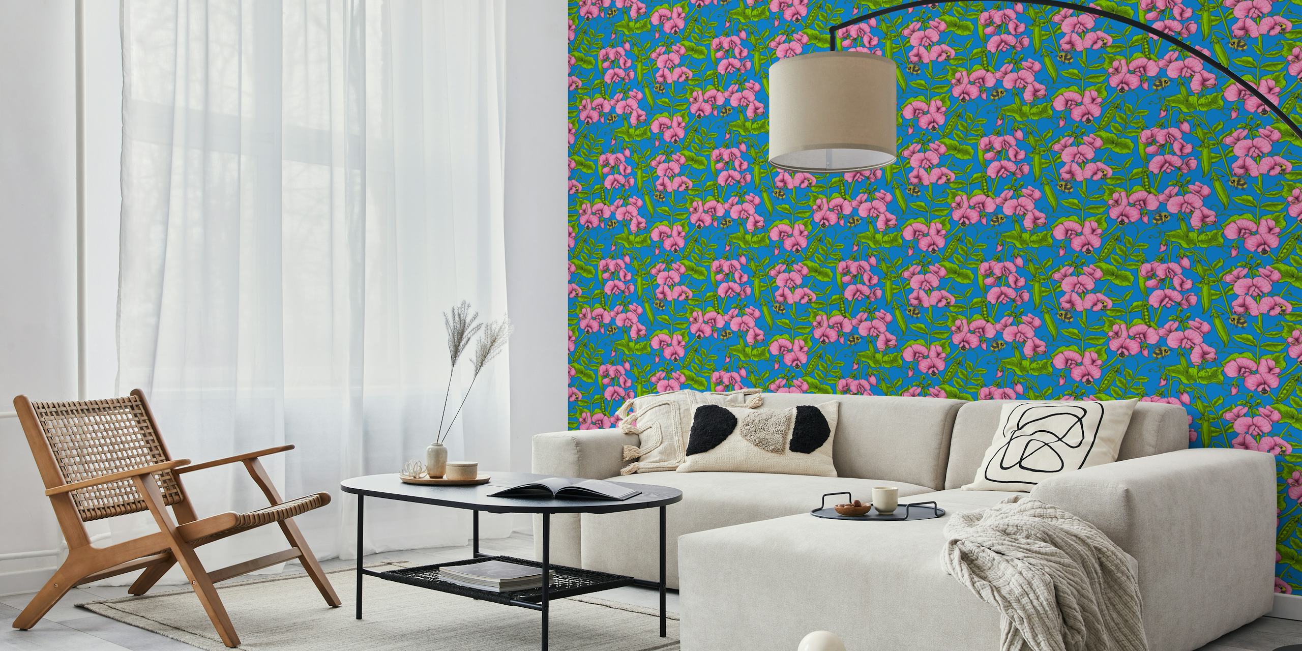 Pink sweet peas and bumblebees on bright blue wallpaper