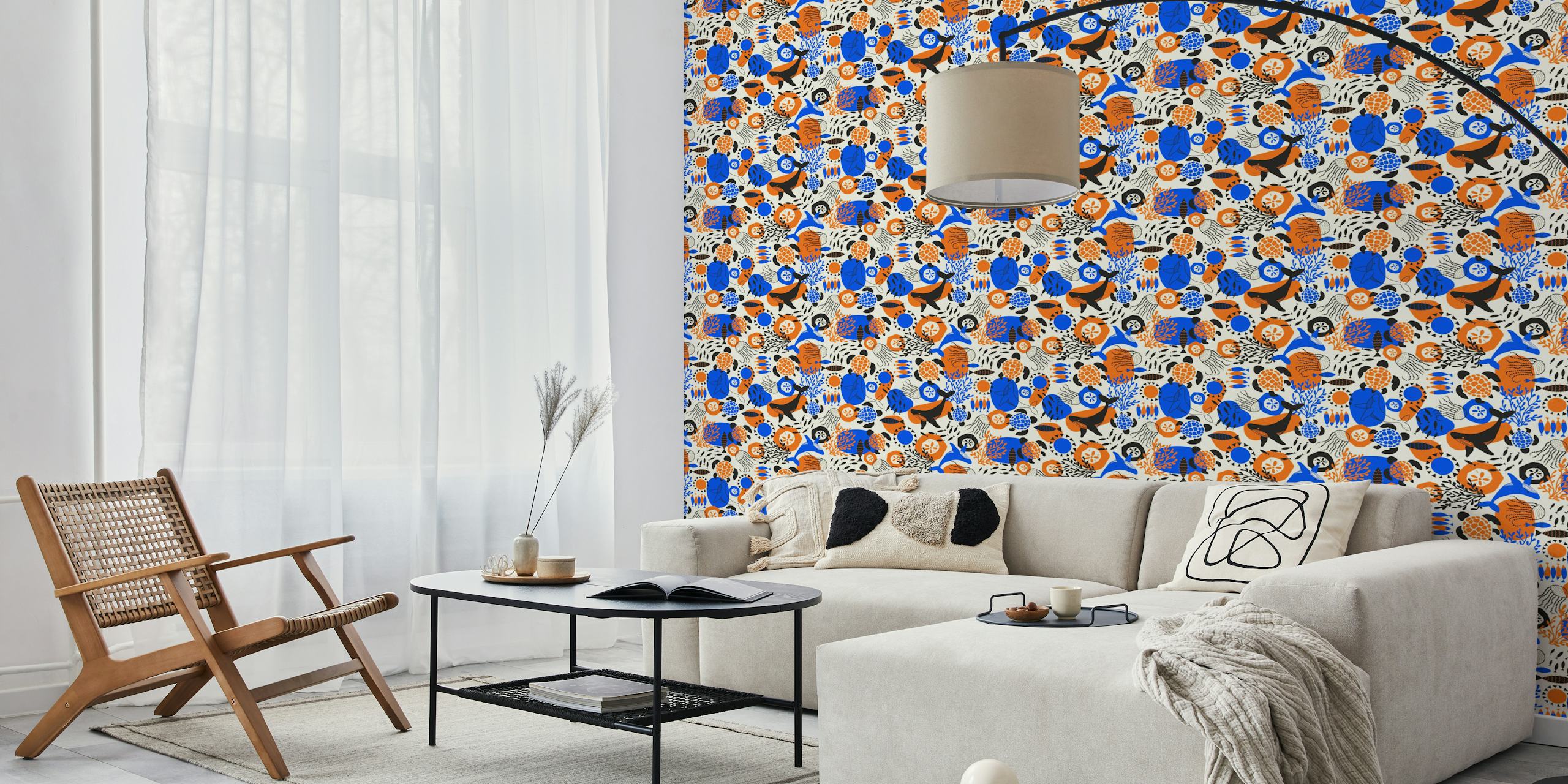 Ocean animals like whales and turtles in vibrant blue, orange, and black on cream wallpaper