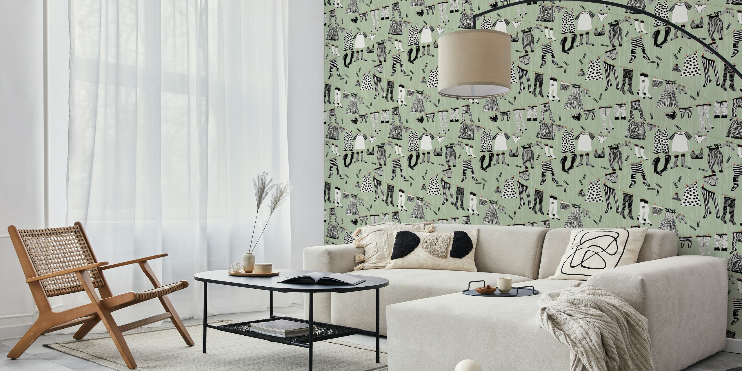 Laundry room wallpaper with black and white hanging clothes on a sage green background