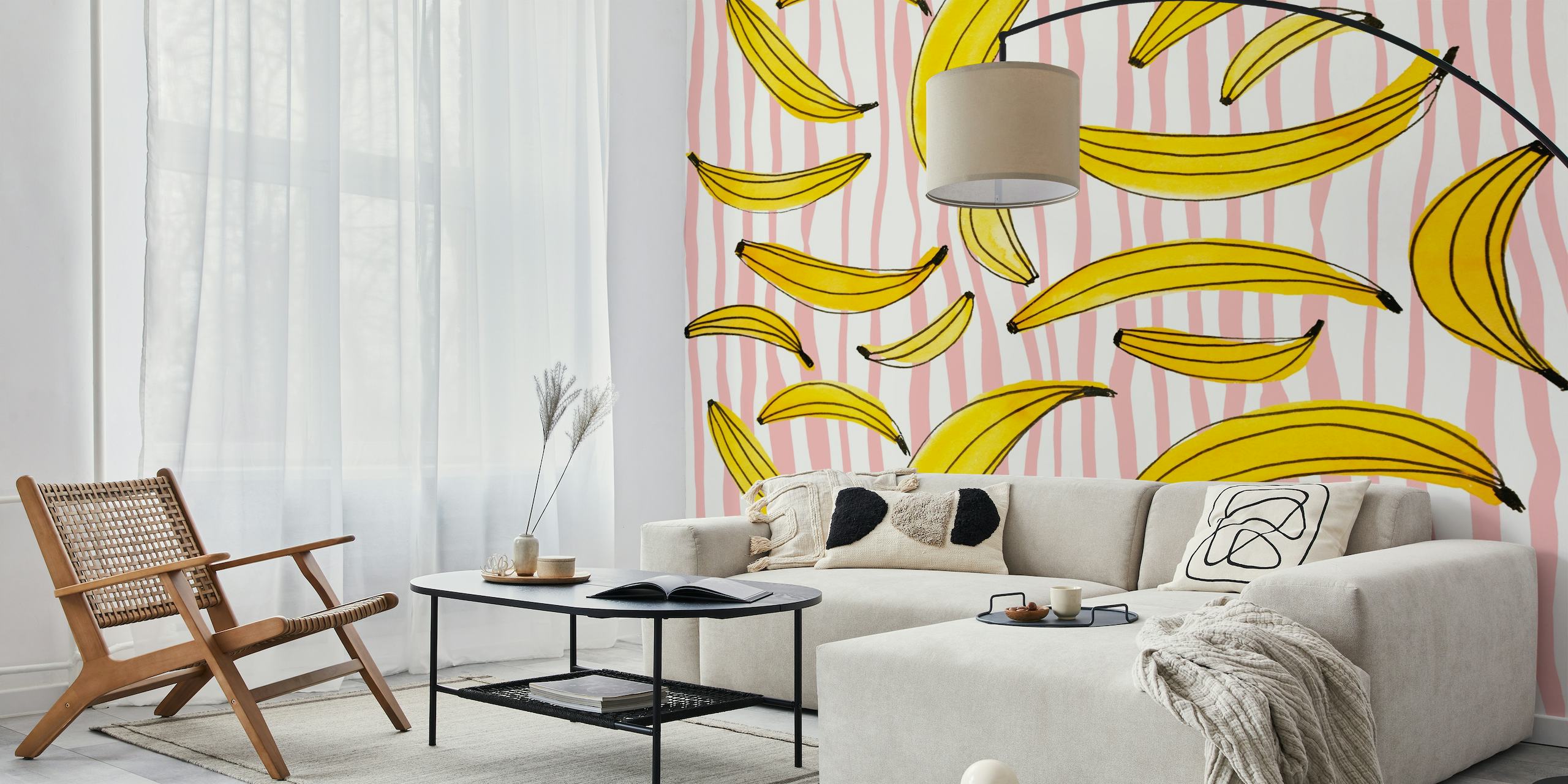 A playful and vibrant watercolor bananas wall mural with a pink striped background