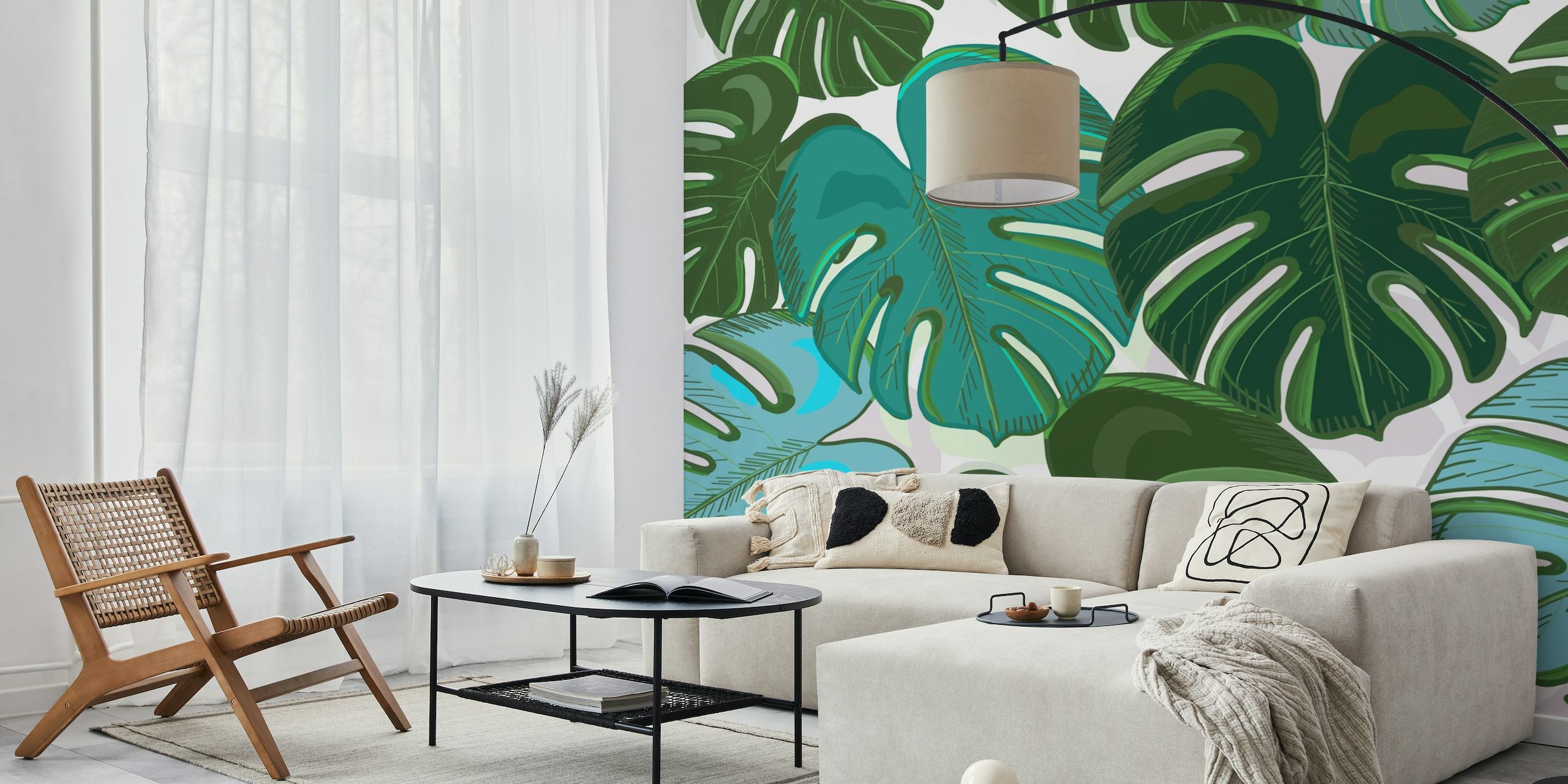 Colorful monstera leaves in shades of green and turquoise on a wall mural