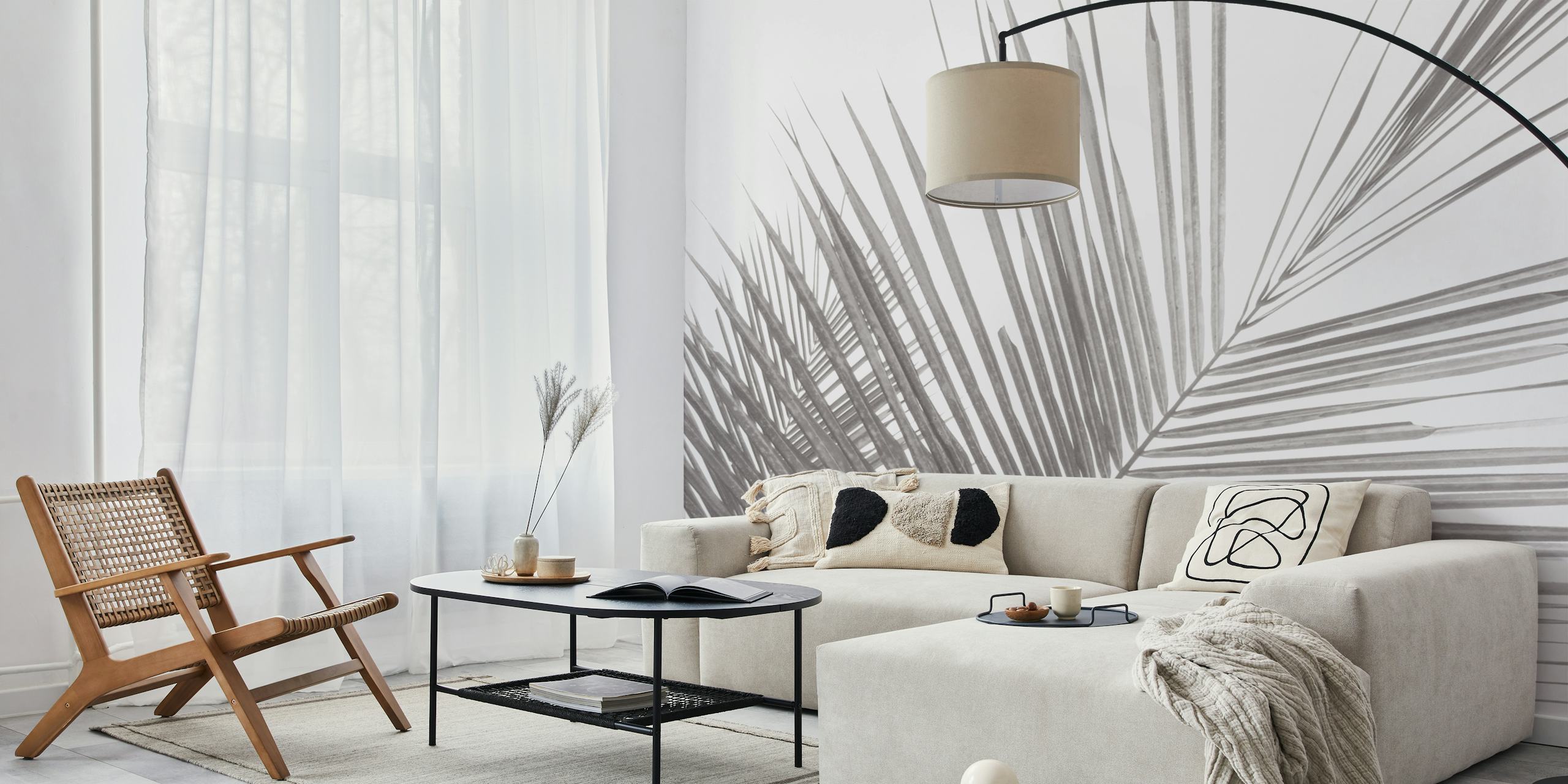 Monochrome tropical palm leaves wallpaper in a room