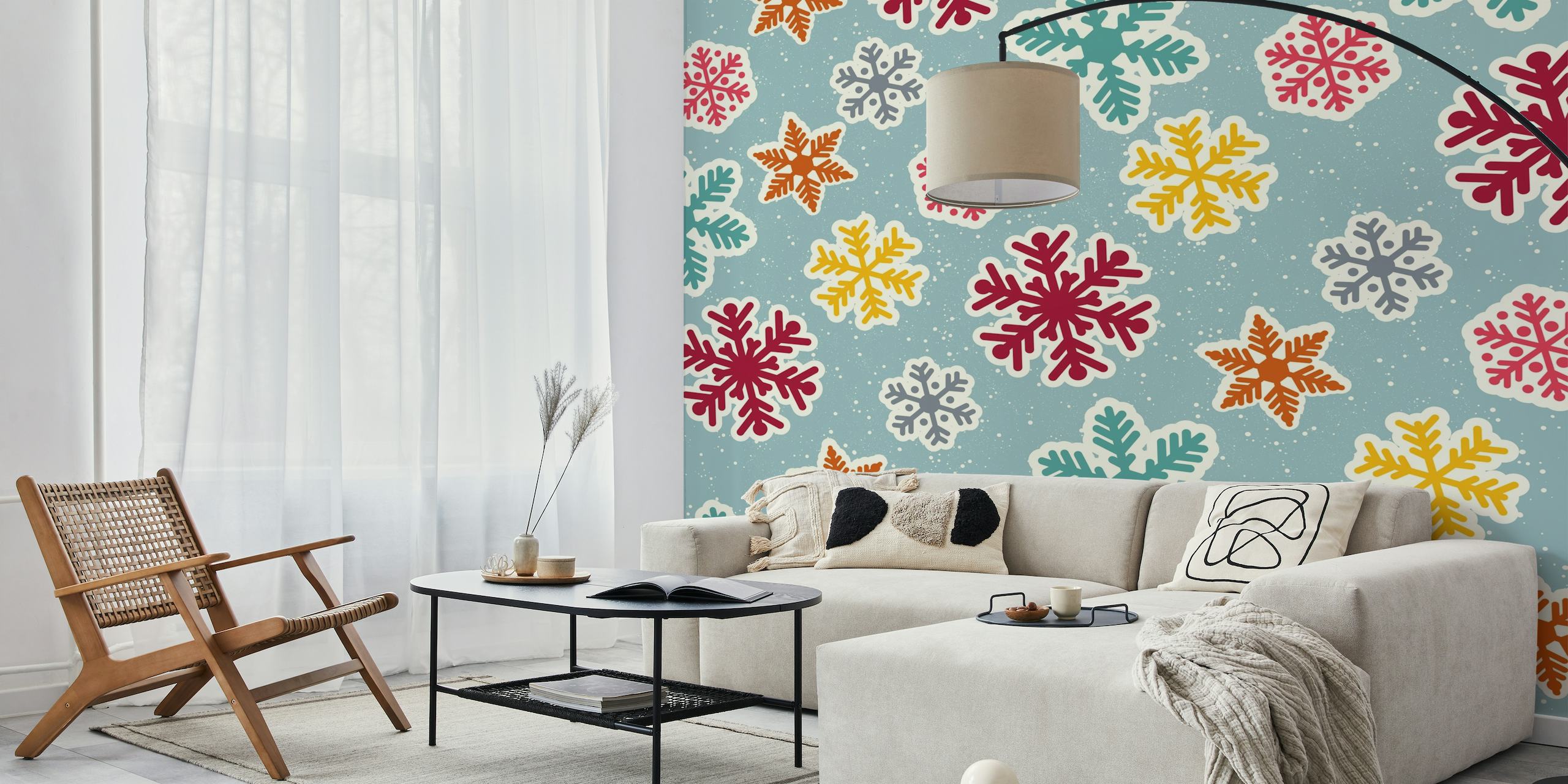 Mid Century Snowflakes wall mural with red, orange, and blue snowflakes on a pale blue background