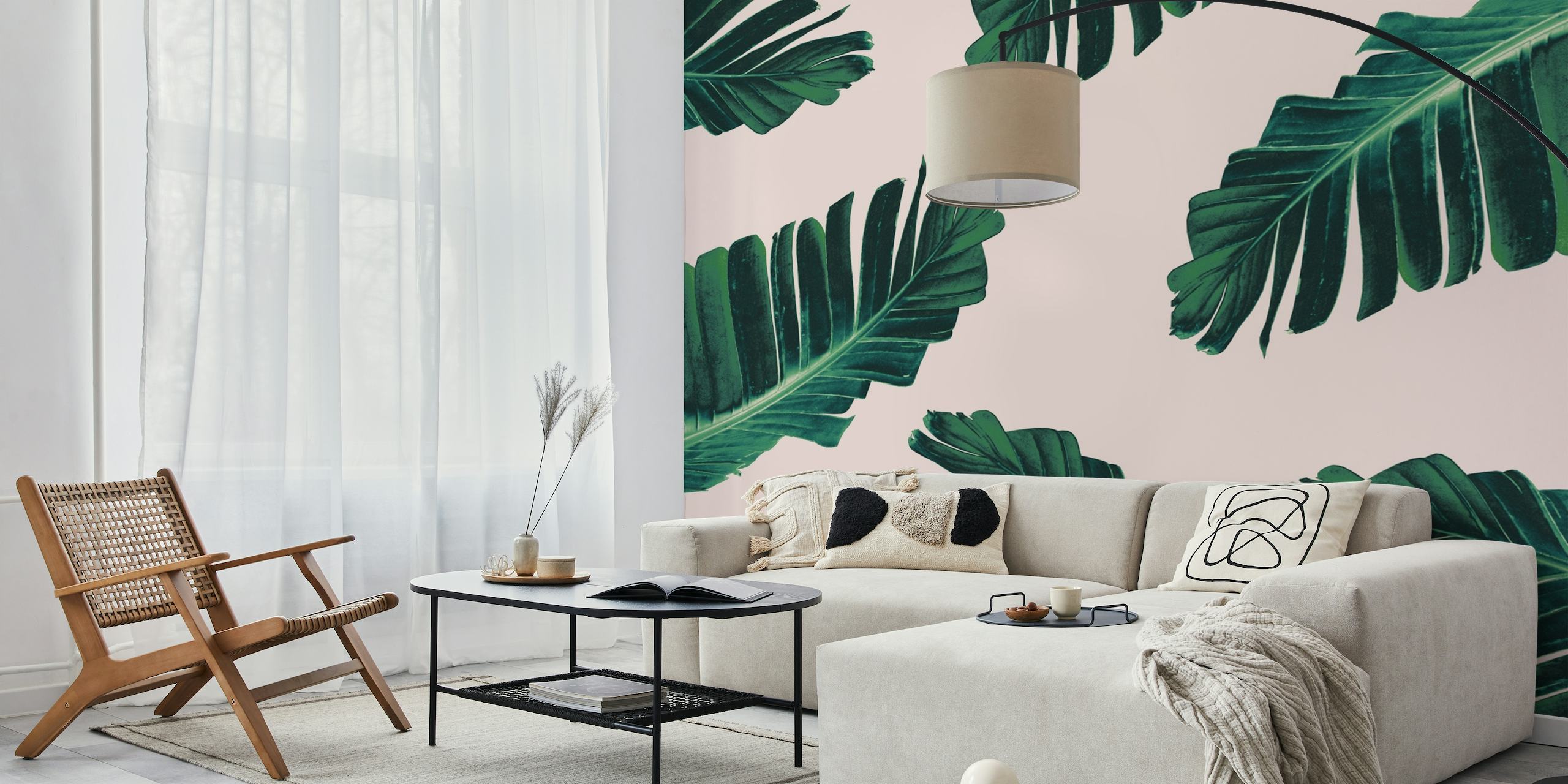Tropical banana leaves on a blush pink background wall mural