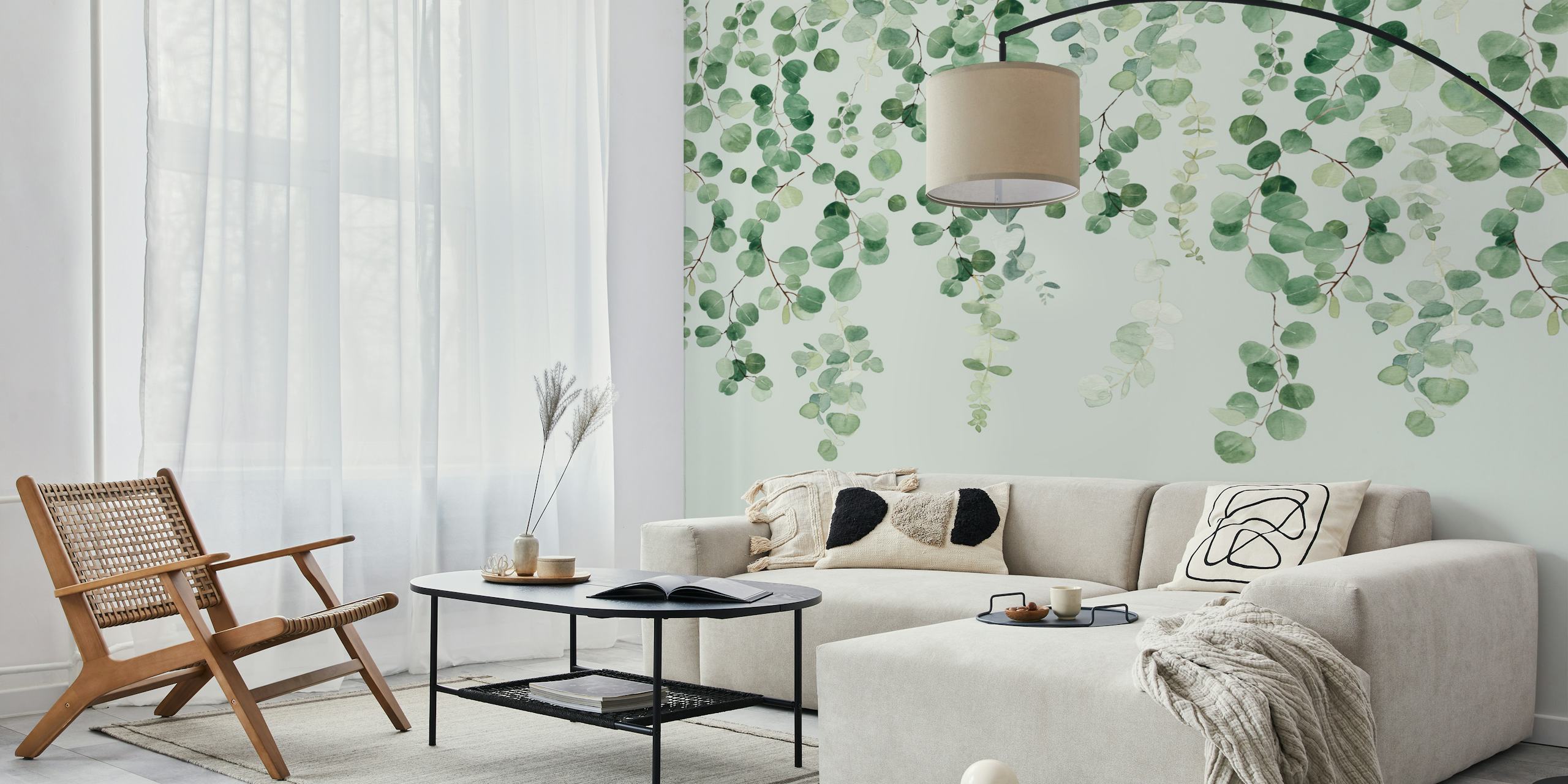 Hanging green eucalyptus leaves on a light background wallpaper