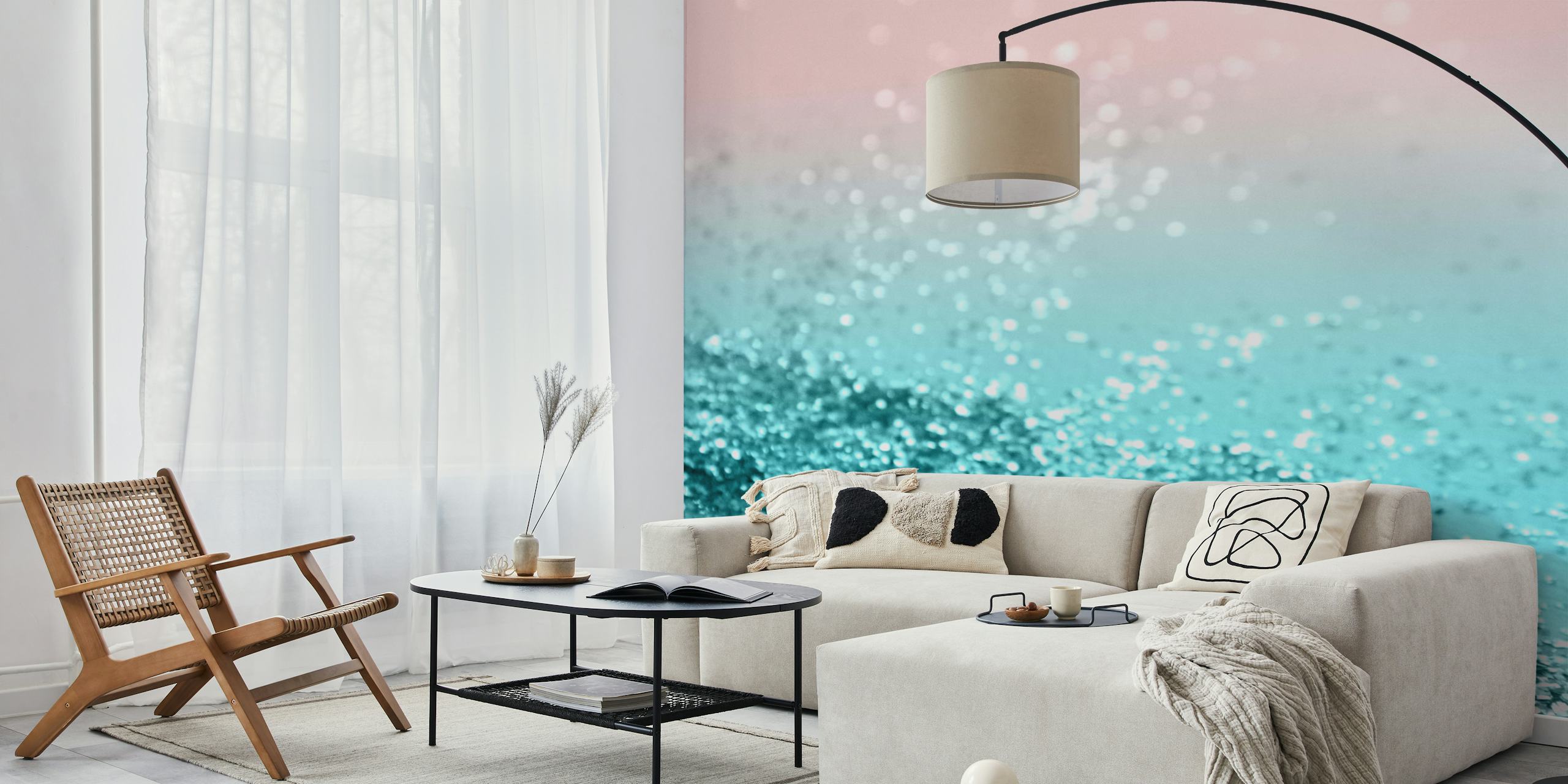 Papier peint dégradé aigue-marine à rose avec une texture pailletée rappelant un rivage d'été tropical.
