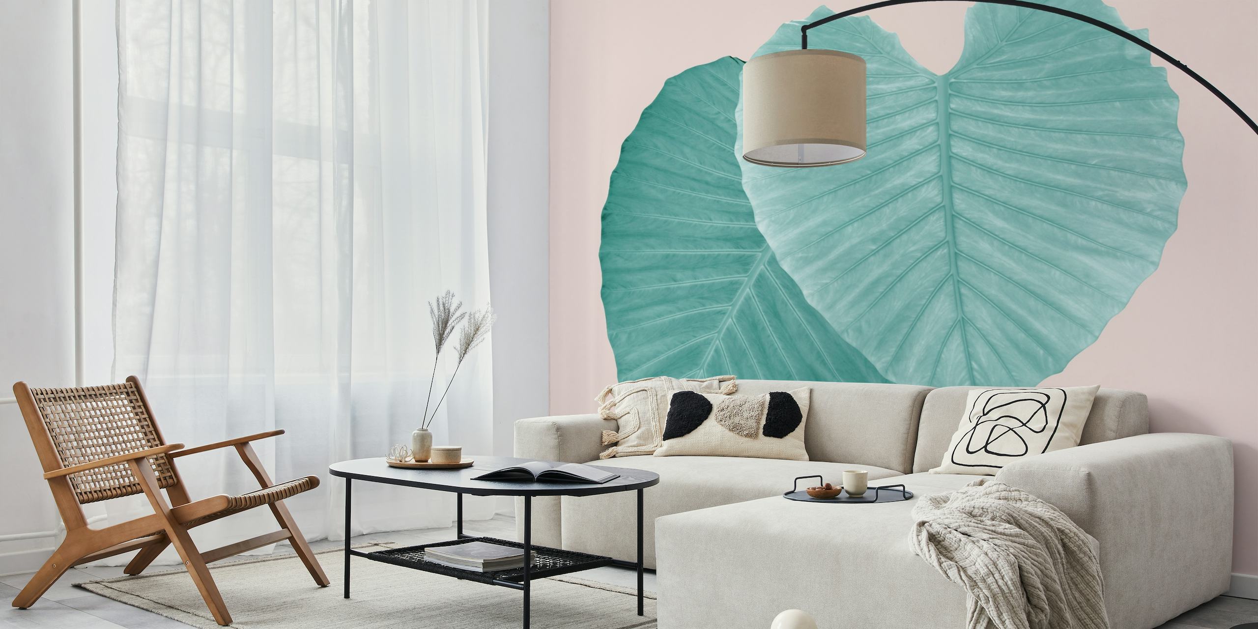 Teal leaves forming a heart on blush pink background wall mural