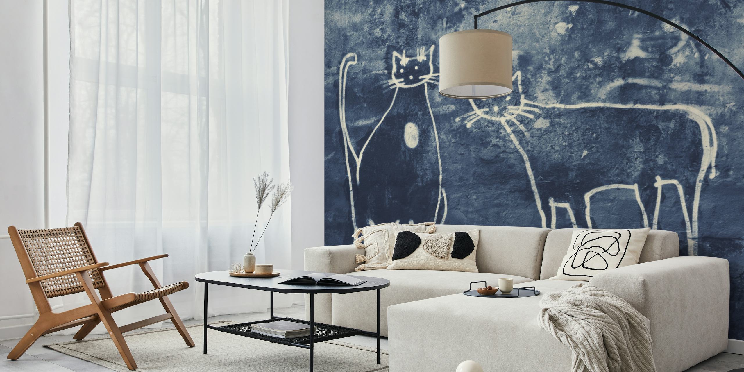 Two white graffiti cats on a dark blue textured wall mural