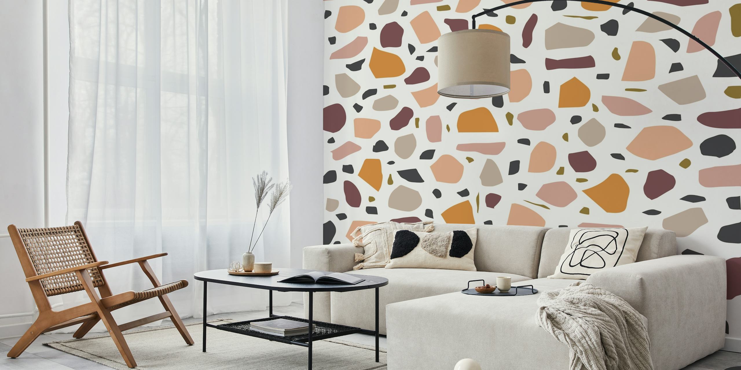 Terrazzo patterned wall mural with warm and neutral toned flecks on a white background