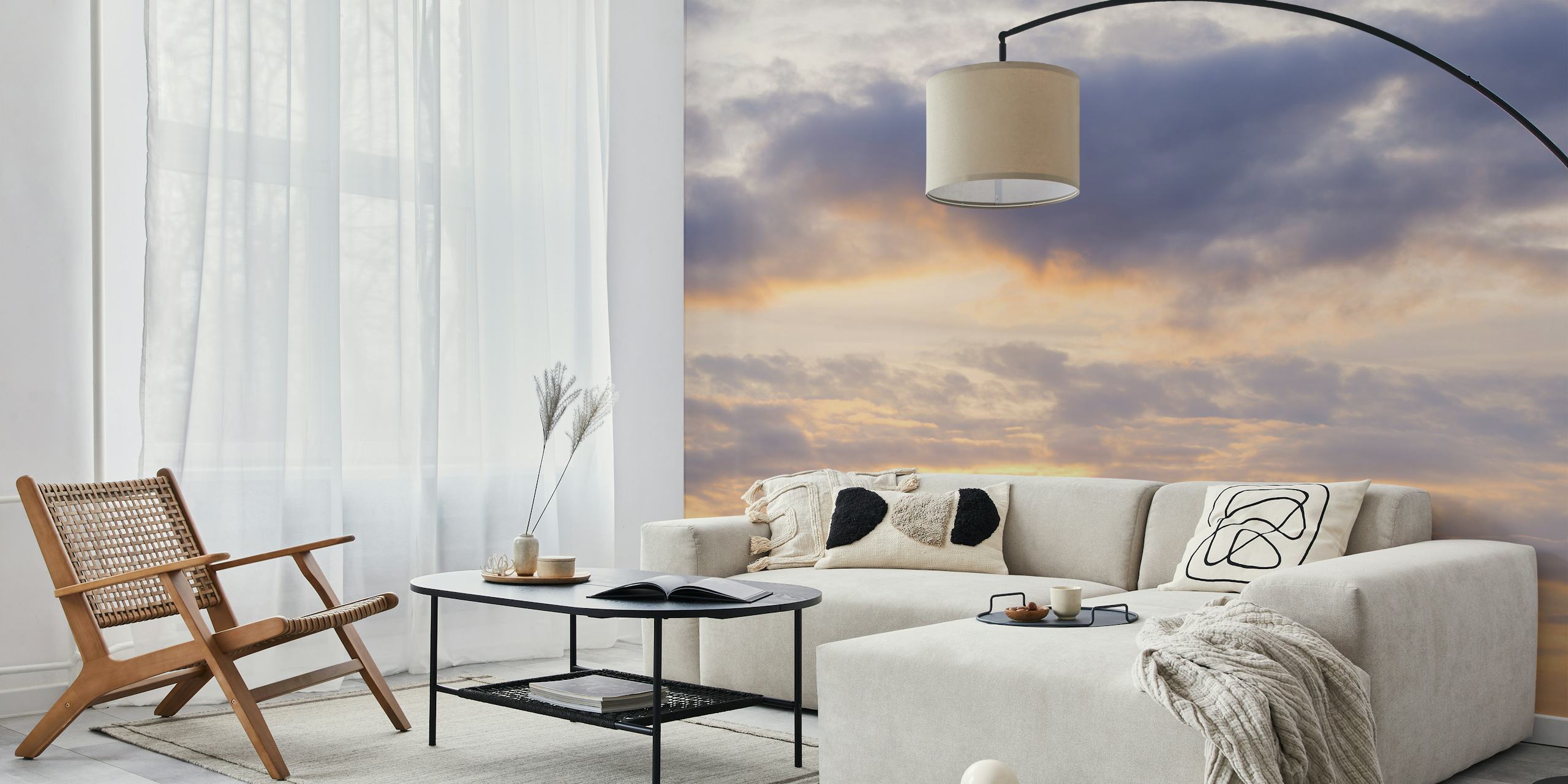 Cloudy sunrise with warm yellows and soft grays wallpaper